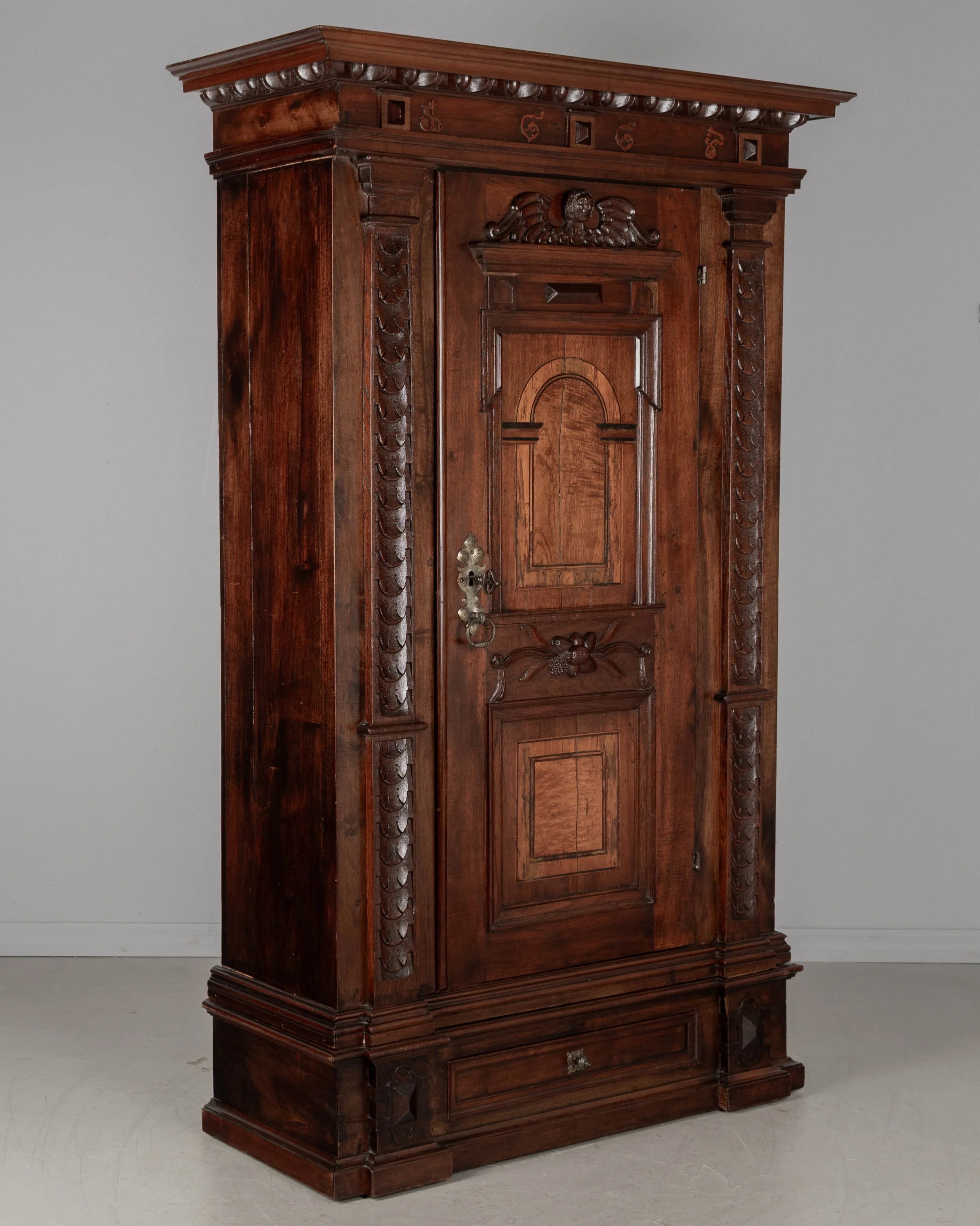 19th Century French Perigord Armoire made of solid walnut and veneers of walnut with pine as a secondary wood.