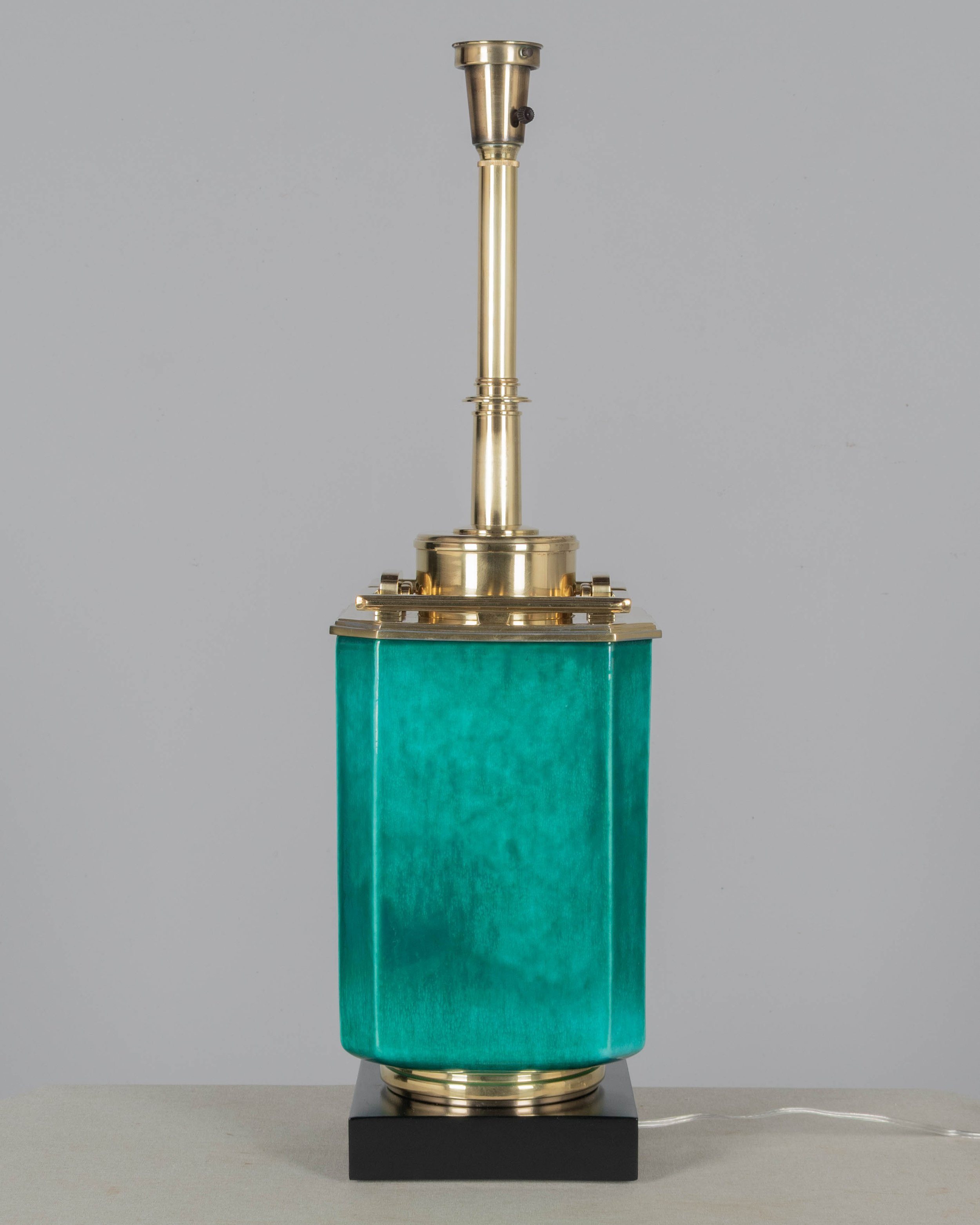 A Mid Century table lamp by Edwin Cole for Stiffel. Large octagonal deeply saturated heavy glazed ceramic body in beautiful shade of turquoise,
