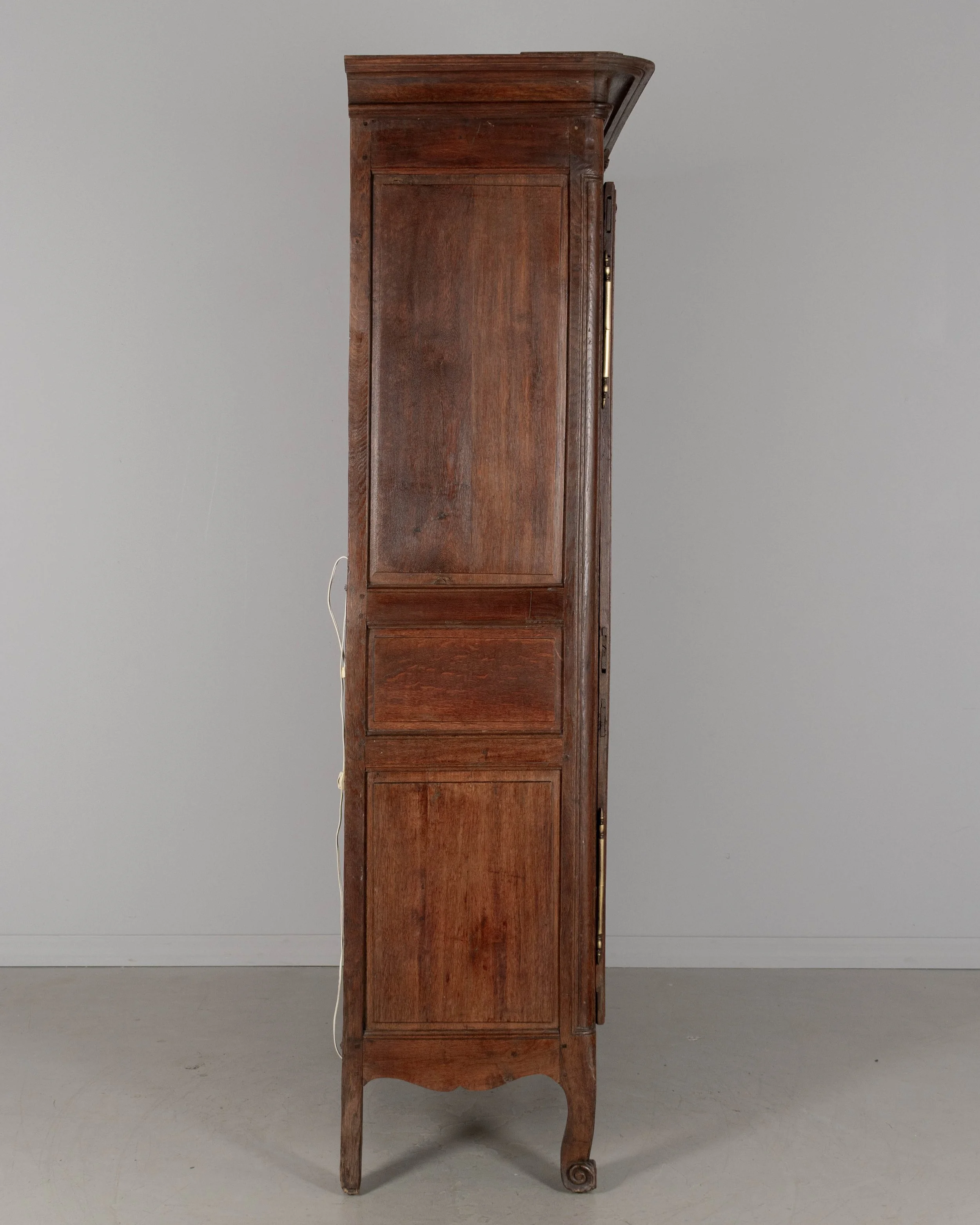 A 19th century Louis XV style Country French armoire, or display cabinet from Normandy.