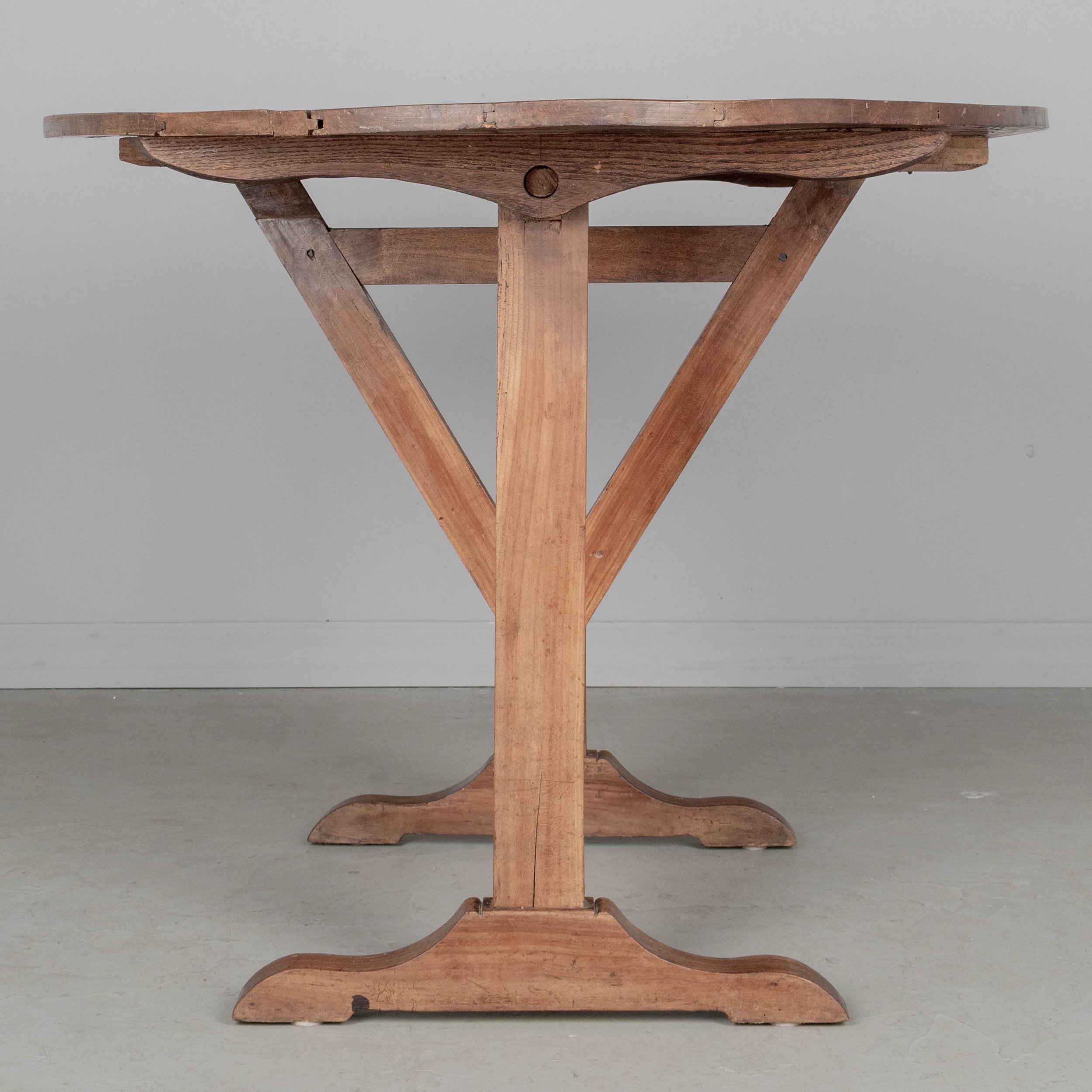 French oval wine tasting, or tilt-top table made of solid cherry.