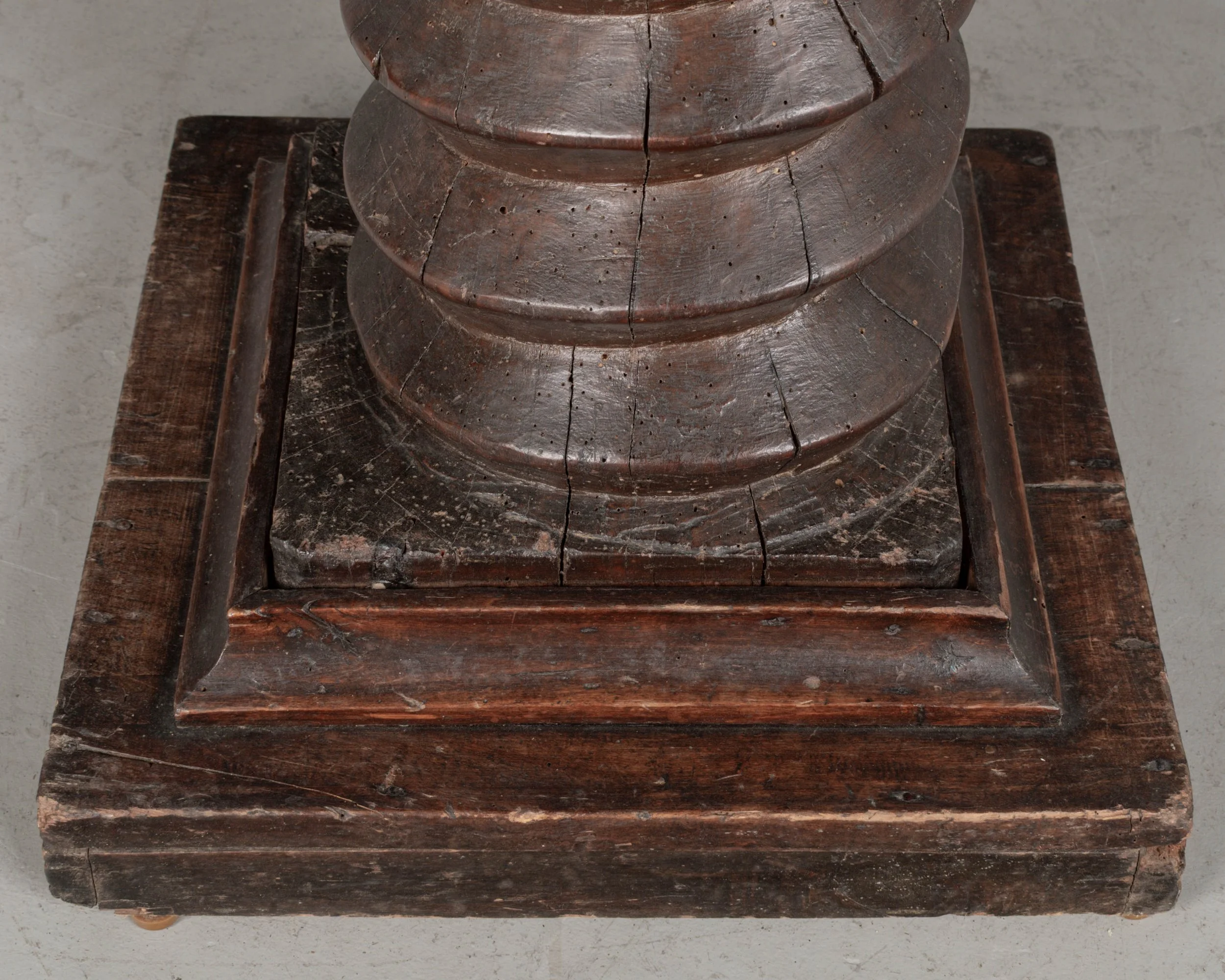 A late 18th century French wooden wine press screw, repurposed as a pedestal or plant stand