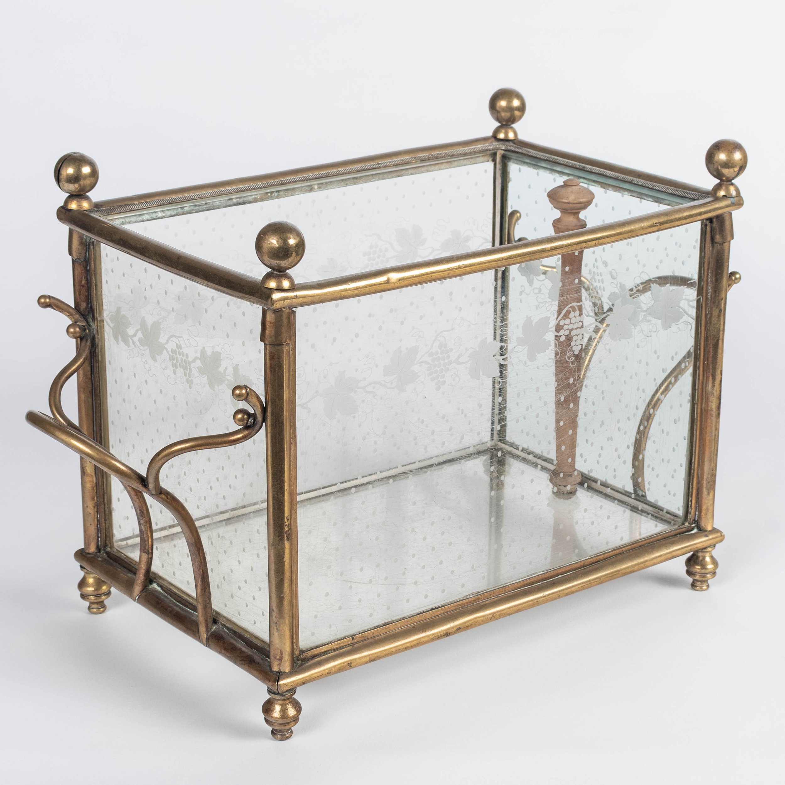A 19th century French Napoleon III etched glass and brass rafraichissoir, or ice chest, on a black wrought iron stand.