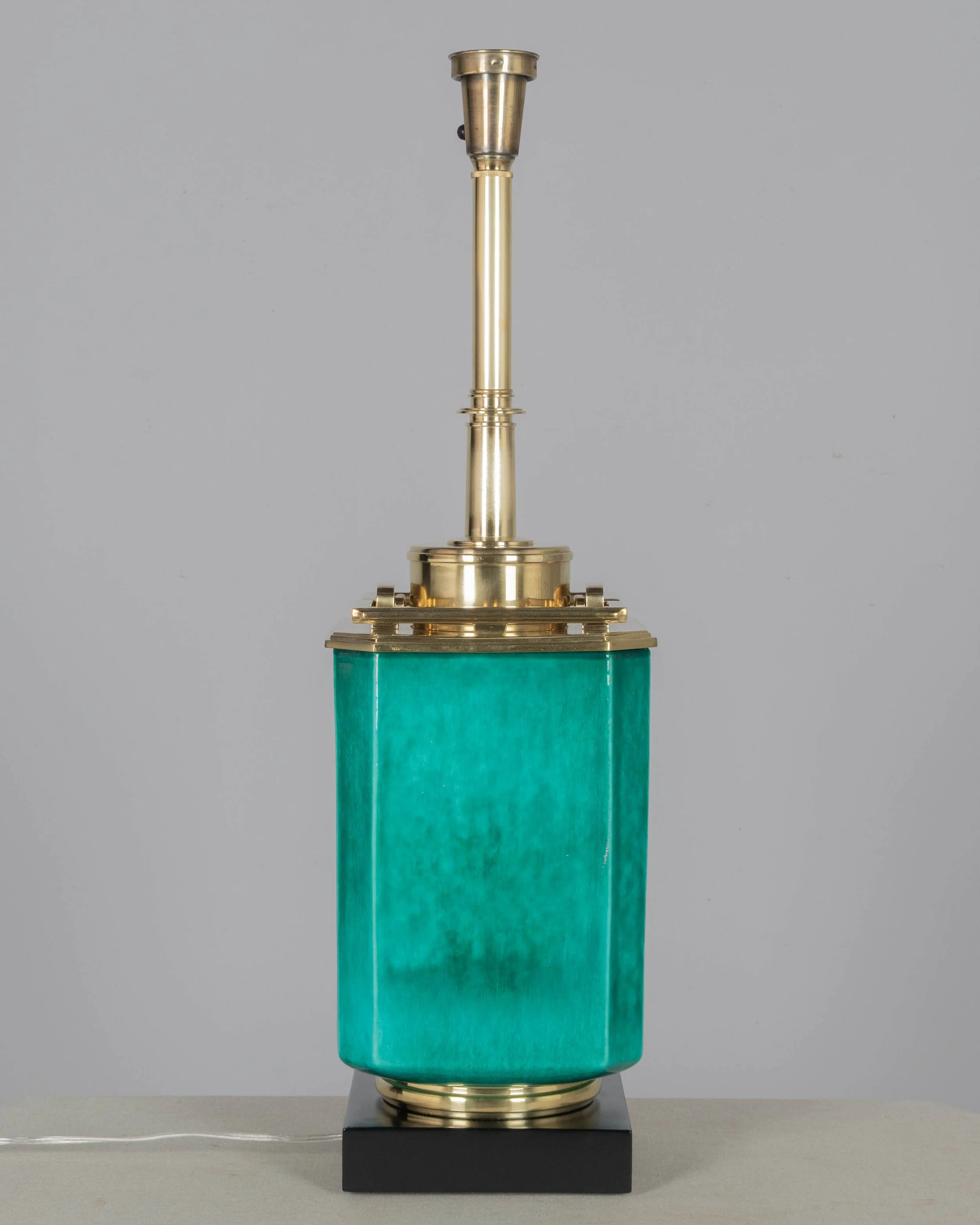 A Mid Century table lamp by Edwin Cole for Stiffel. Large octagonal deeply saturated heavy glazed ceramic body in beautiful shade of turquoise,