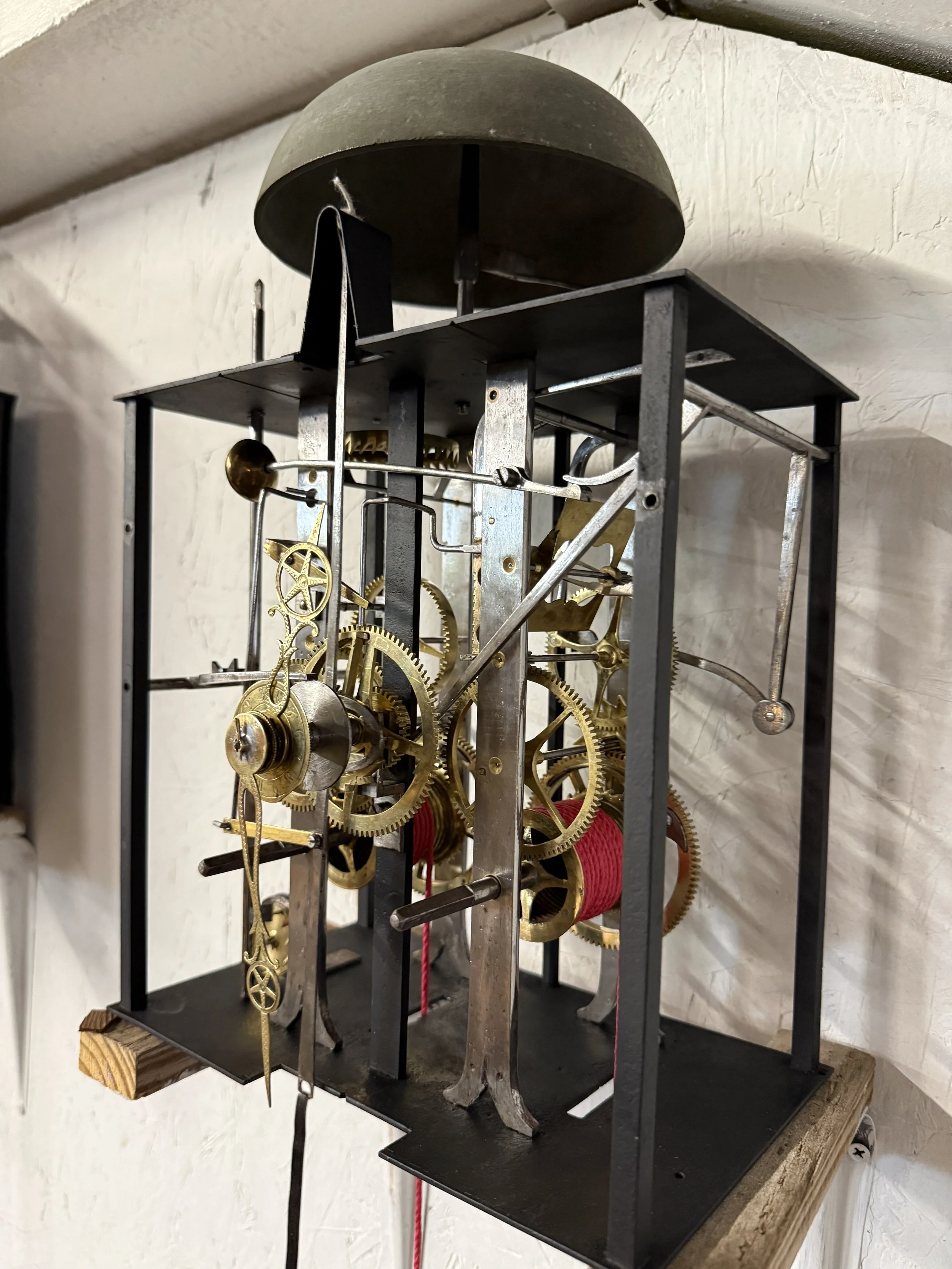A late 19th century Morbier works for a tall case clock from Jobert Horloger at St Laurent Mâcon with brass embossment of Sun King