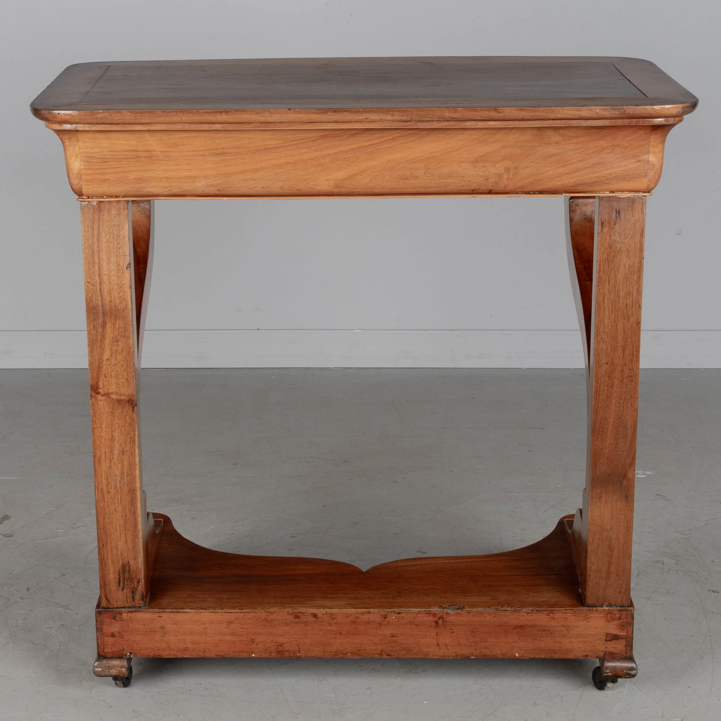 A 19th century French Louis-Philippe console made of solid walnut and veneer of walnut