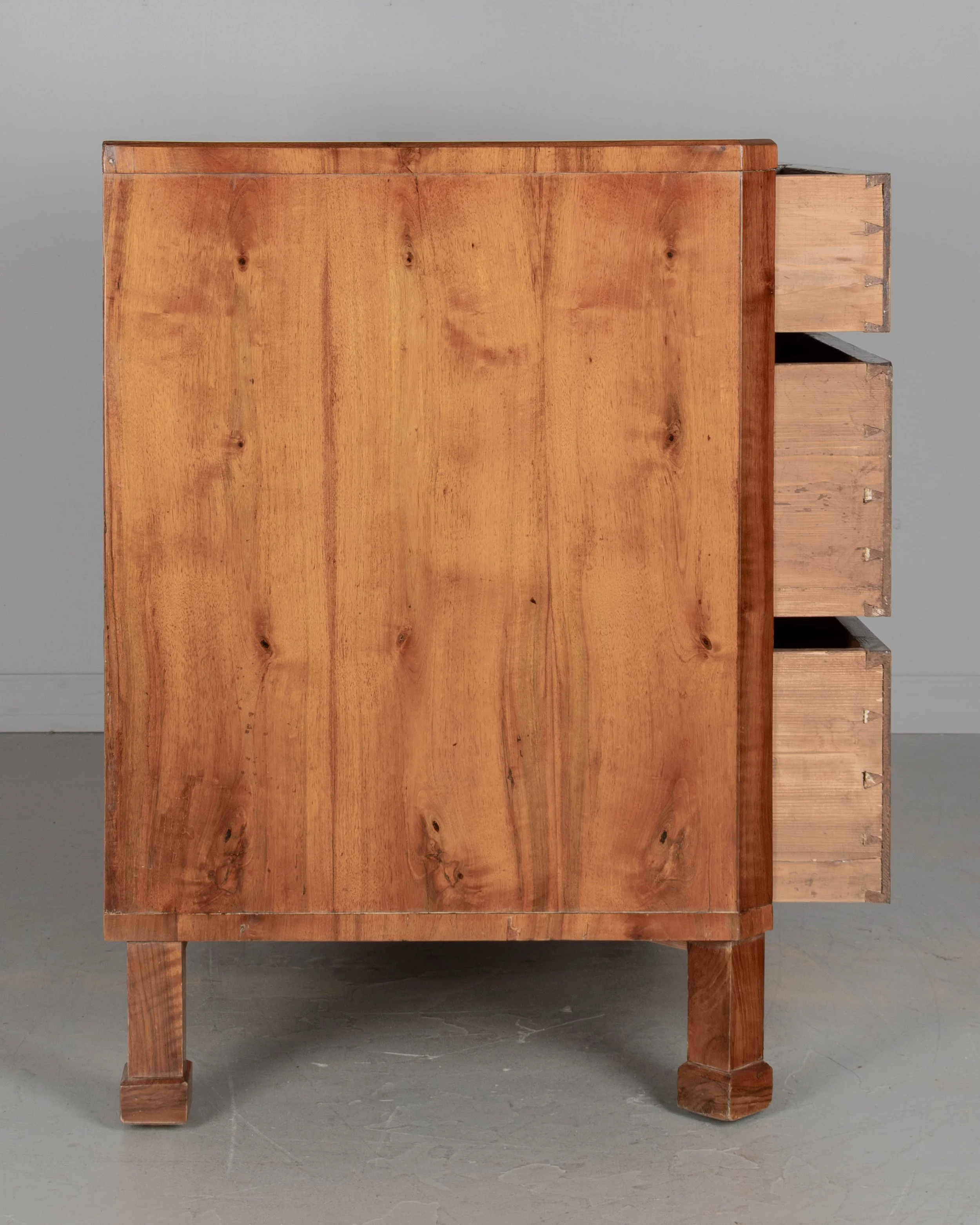 A fine 19th century Biedermeier commode from Austria made with beautifully patterned book matched veneer of walnut over pine.