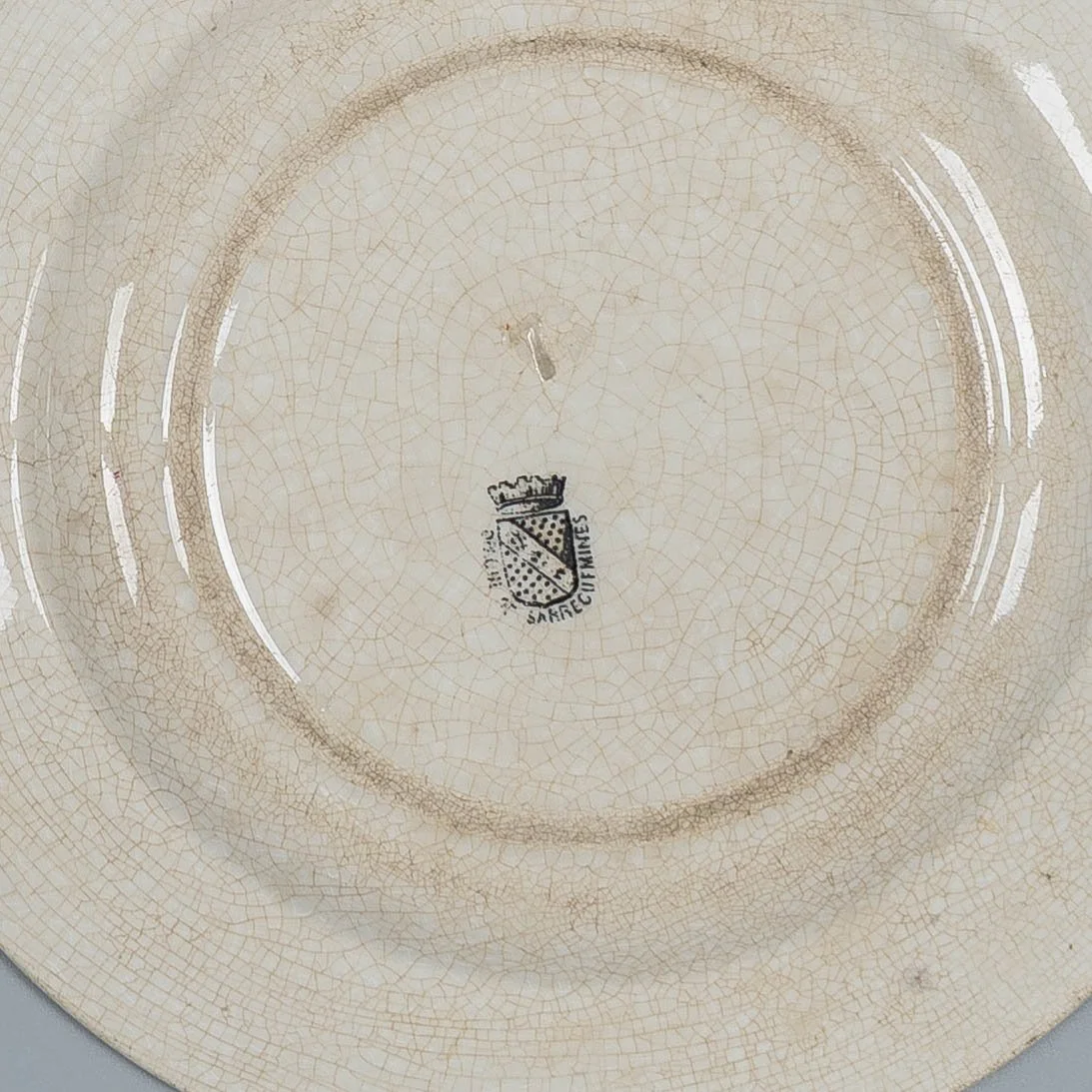 A set of three 19th Century French glazed faience plates made by Sarreguemines