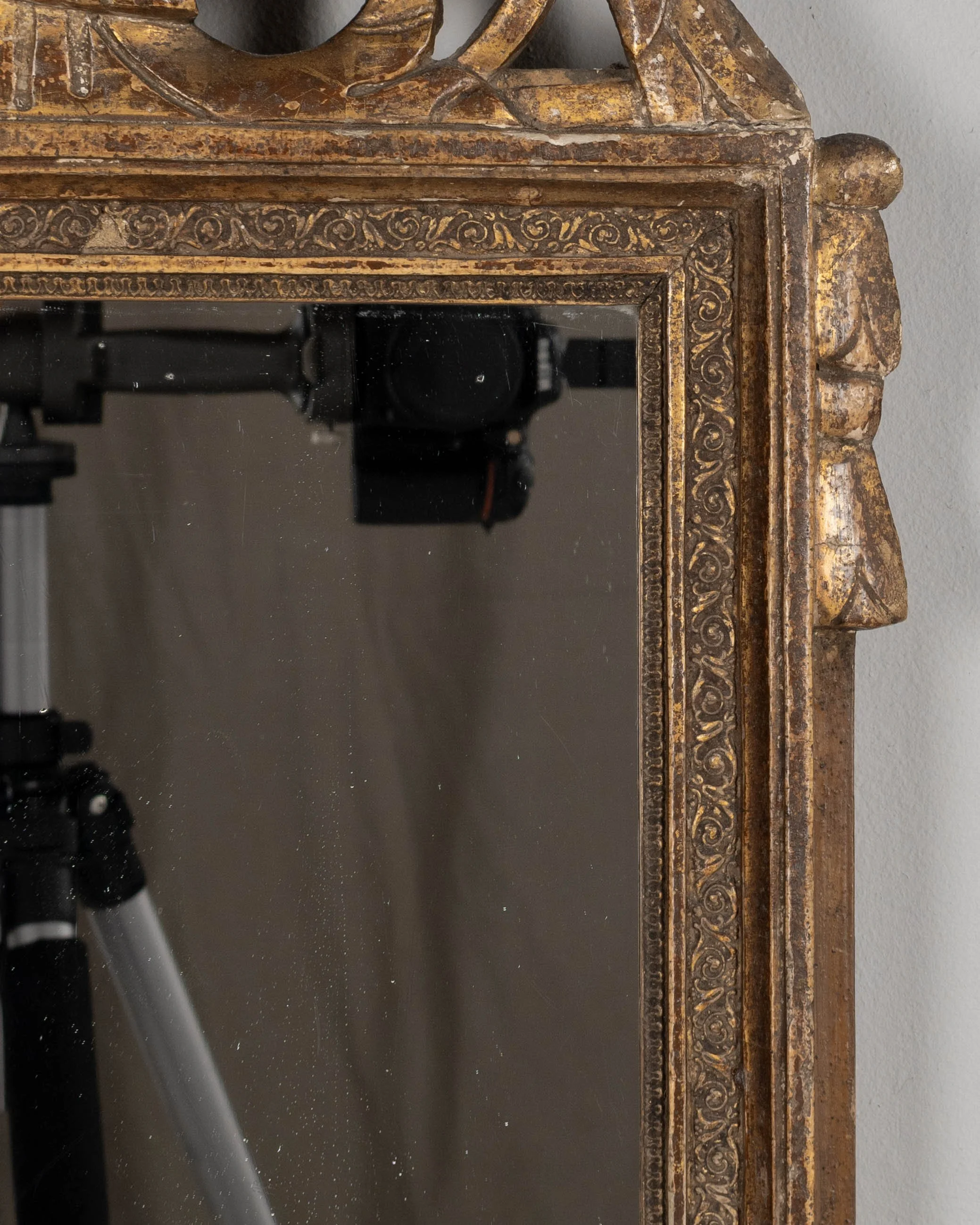 An early 19th century Louis XVI style French Provençal giltwood mirror.