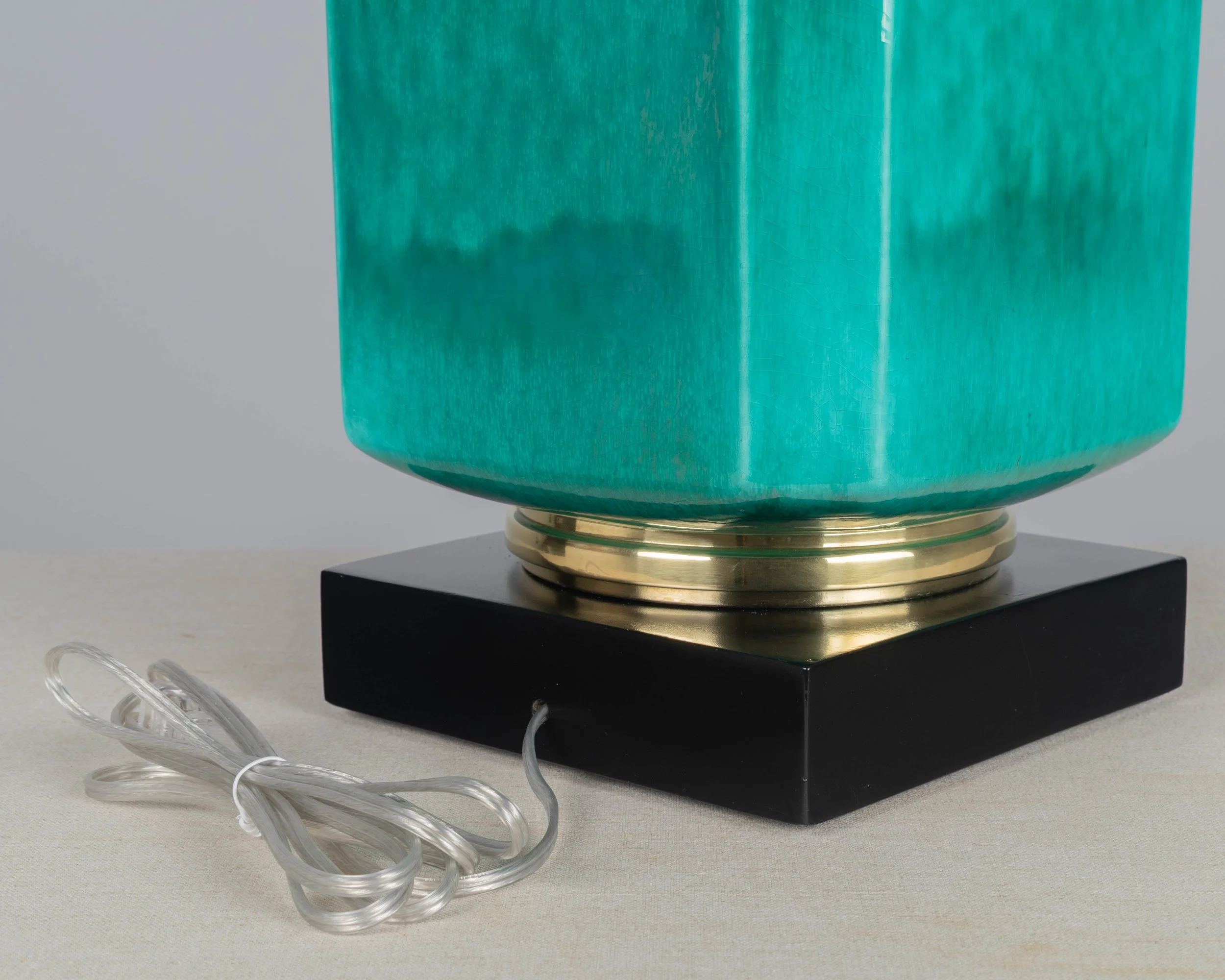 A Mid Century table lamp by Edwin Cole for Stiffel. Large octagonal deeply saturated heavy glazed ceramic body in beautiful shade of turquoise,
