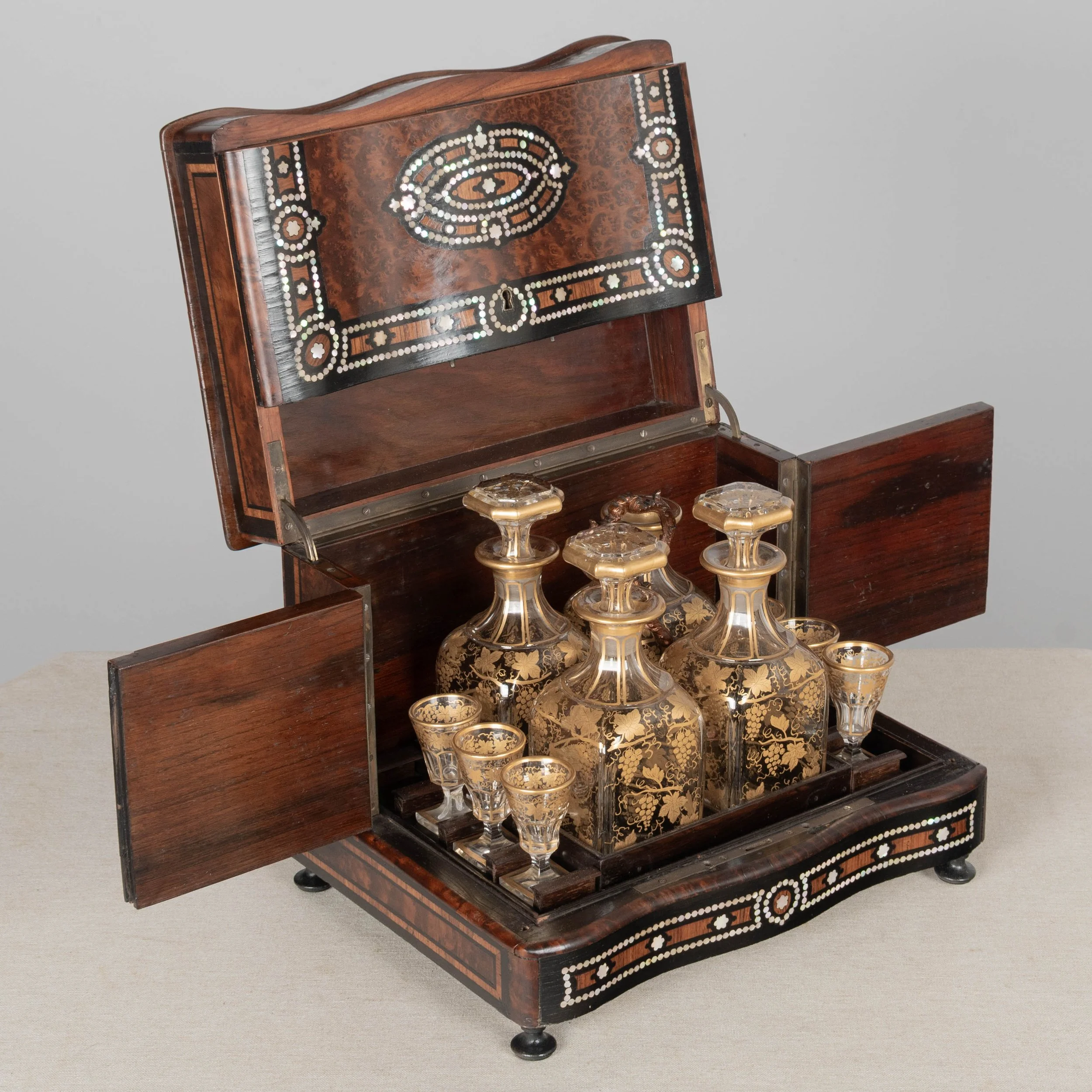 A fine 19th century French Napoleon III tantalus, or cave à liqueur, in the style of Charles-Guillaume Diehl