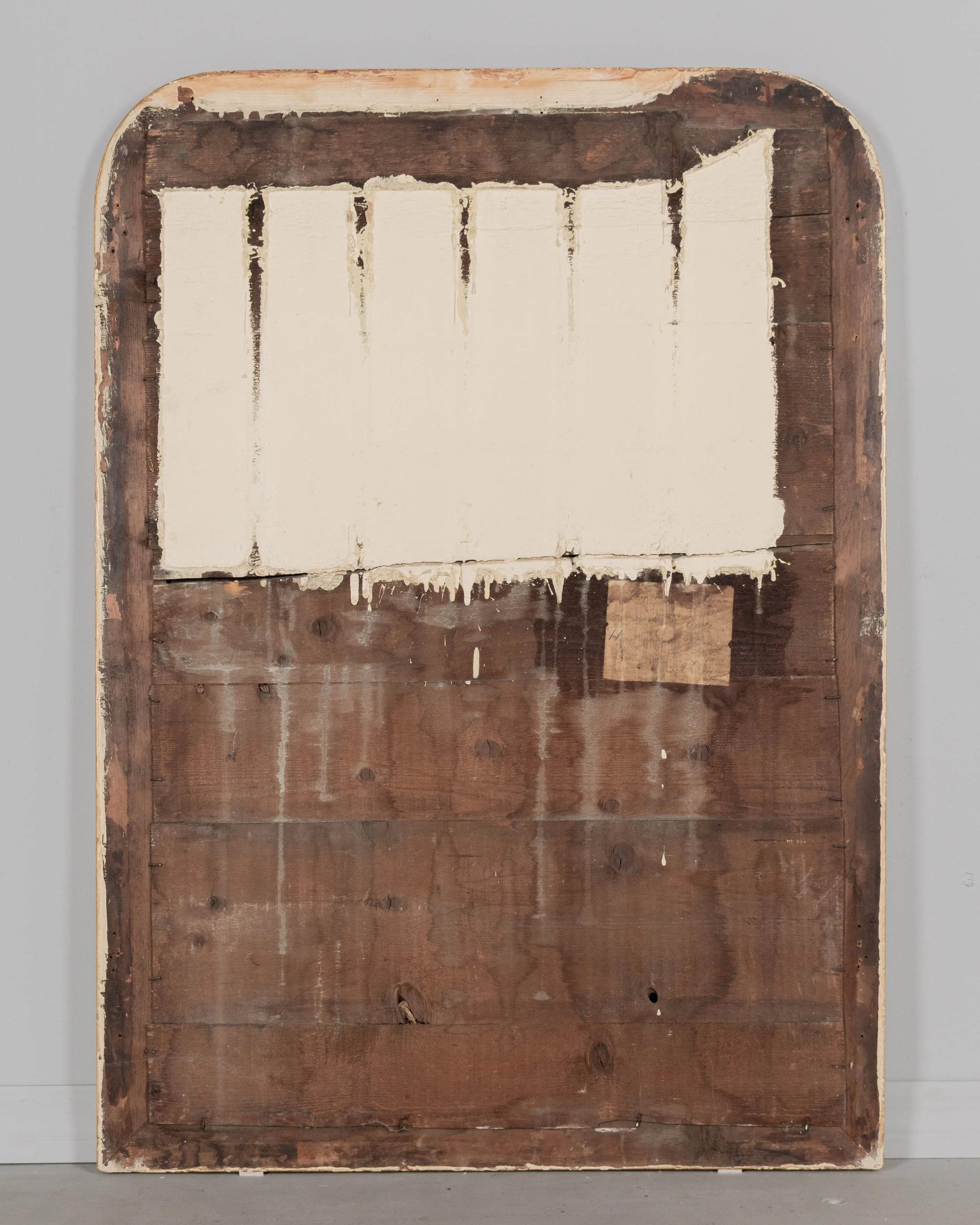 A 19th century French Louis Philippe style gilded mirror with curved top corners, incised ribbed decoration and inner bead border.