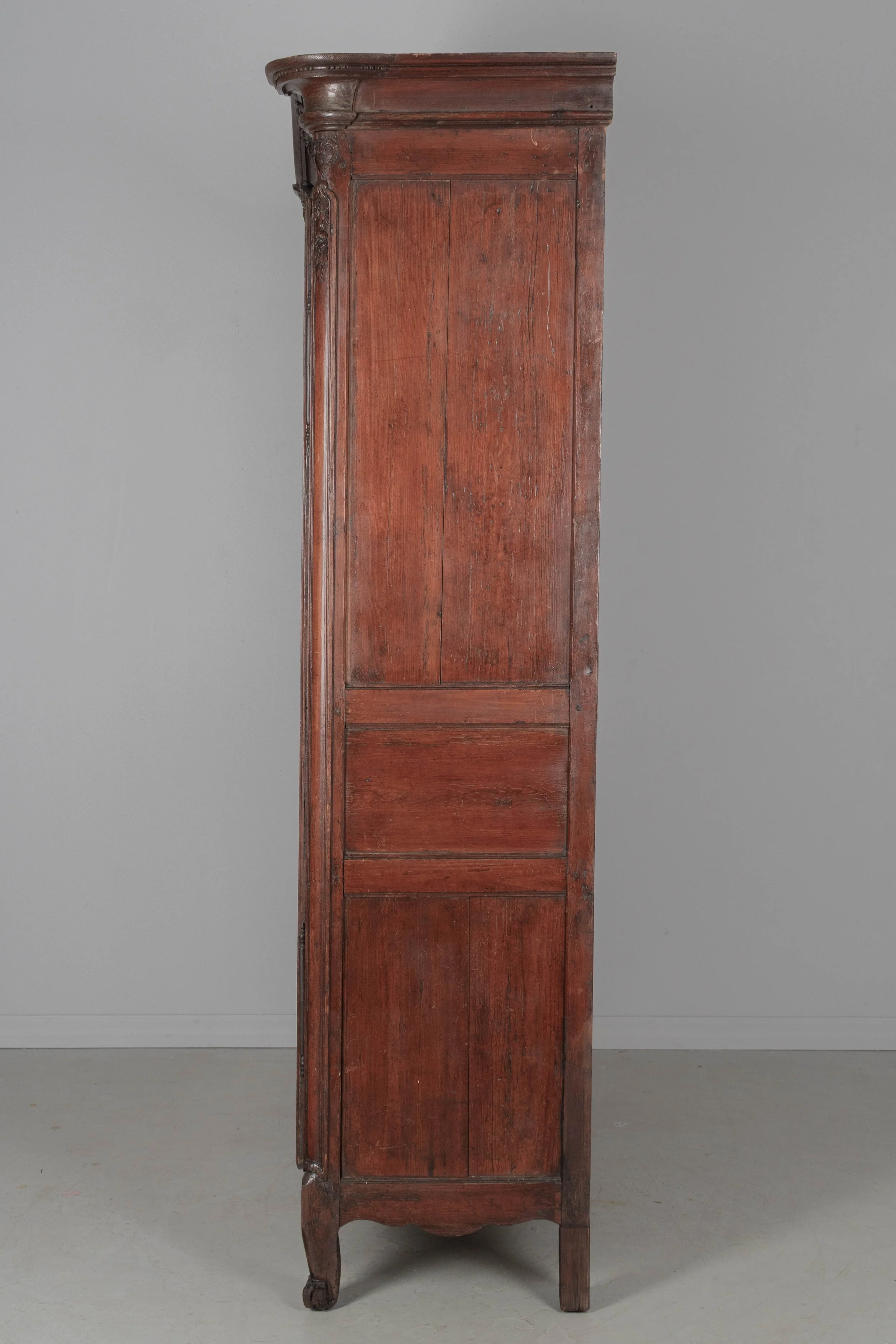 An early 19th century Louis XV country French bridal armoire from Normandy.