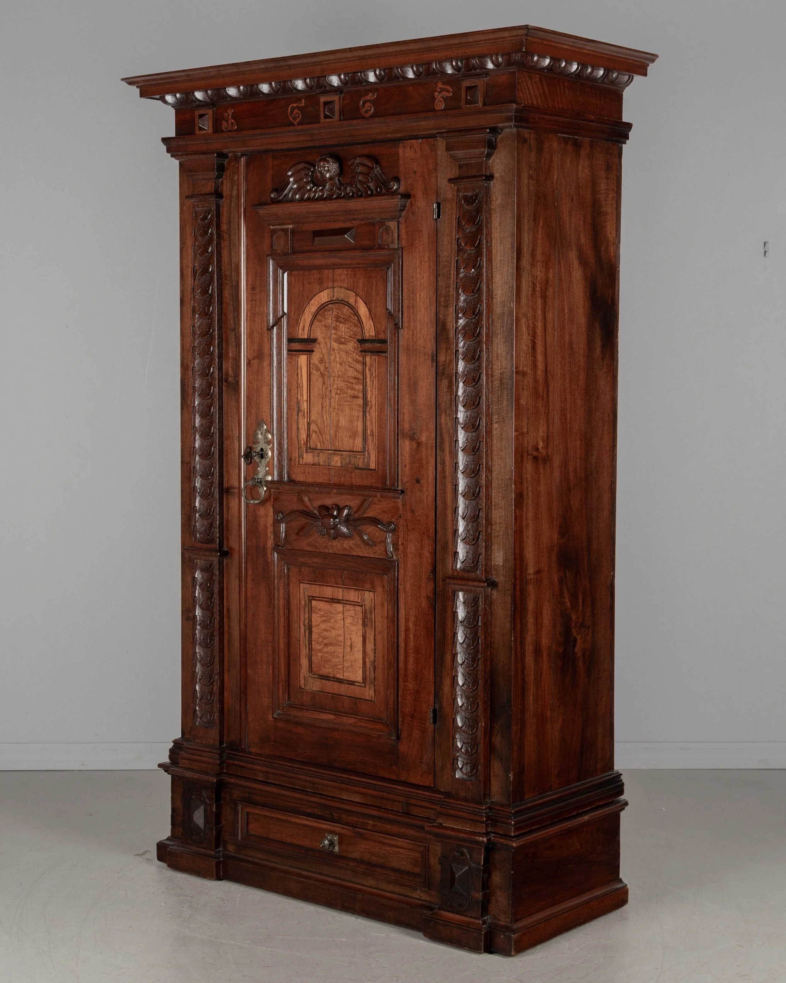 19th Century French Perigord Armoire made of solid walnut and veneers of walnut with pine as a secondary wood.