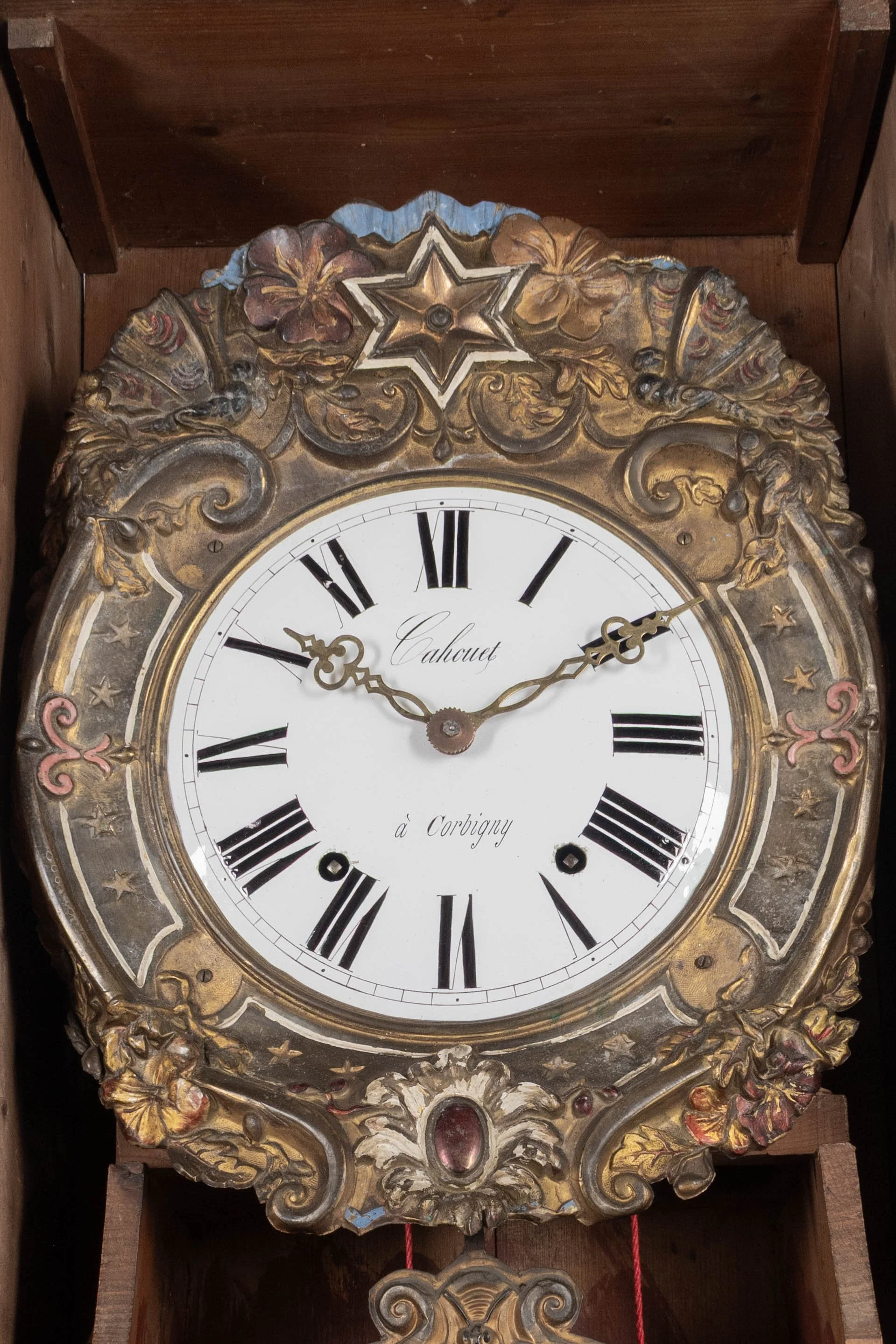 19th century Country French comtoise, or grandfather clock, with polychrome painted pine case and embossed brass pendulum.