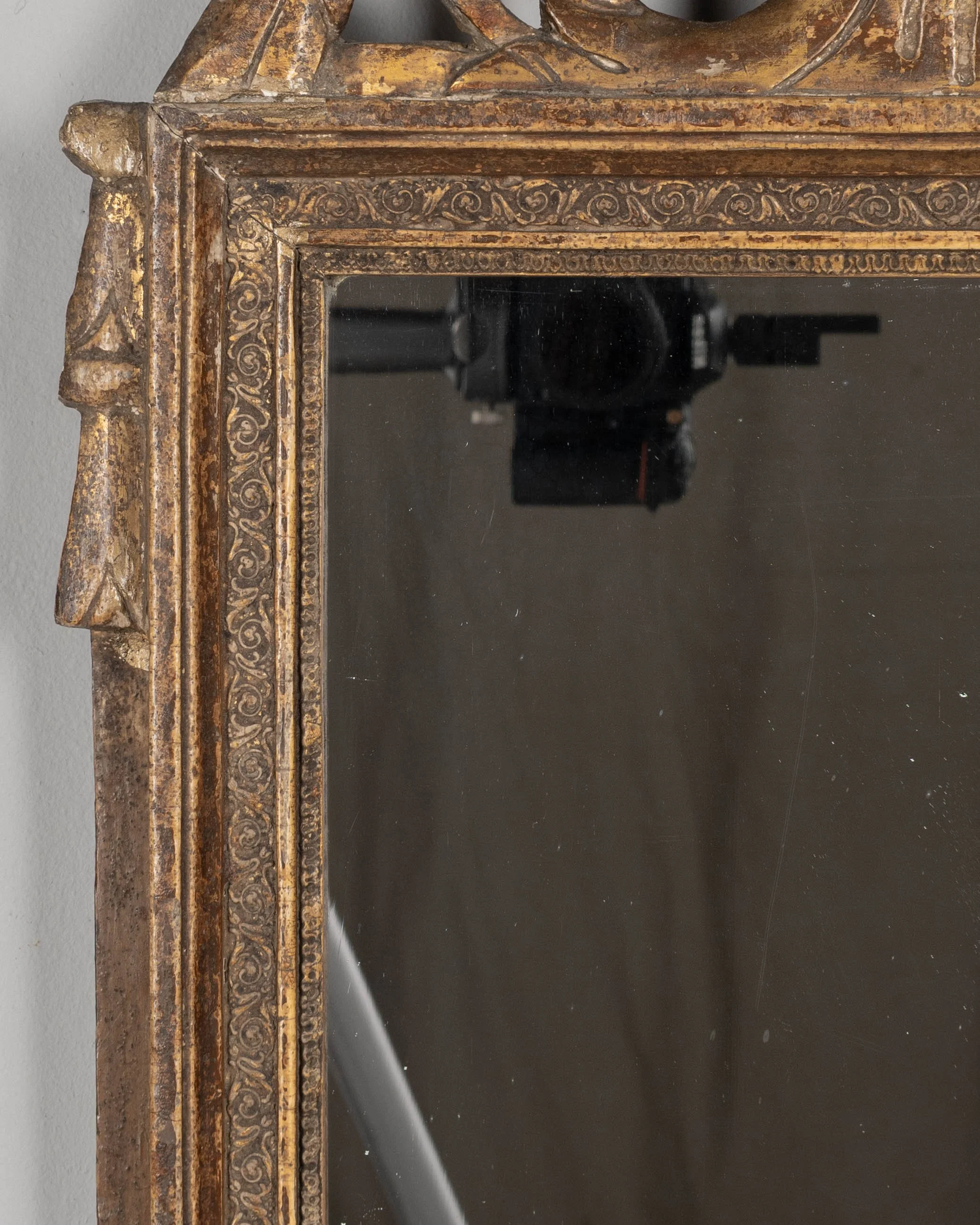 An early 19th century Louis XVI style French Provençal giltwood mirror.
