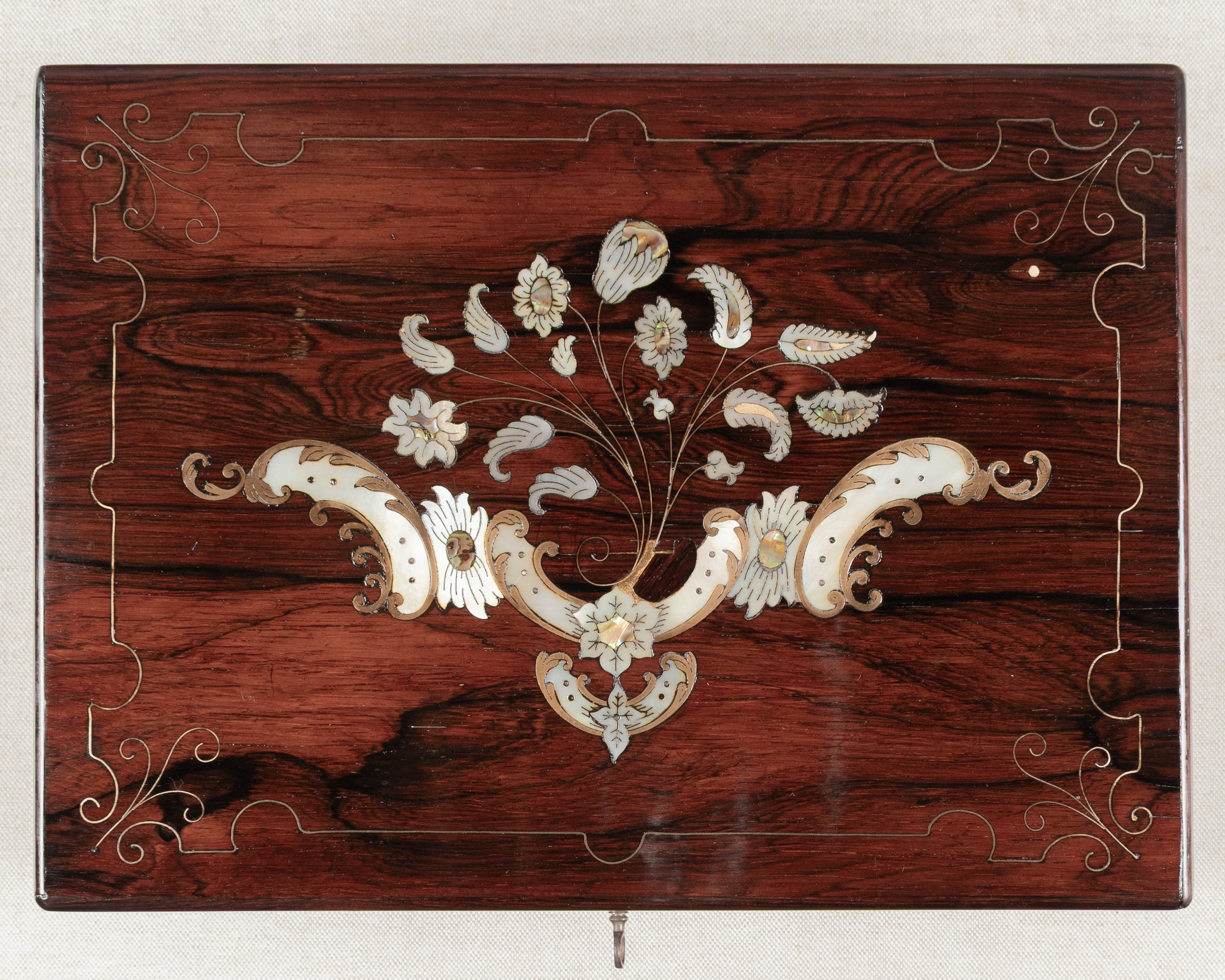A 19th Century French Napoleon III marquetry box made of rosewood veneer with fine mother-of-pearl and brass inlay.