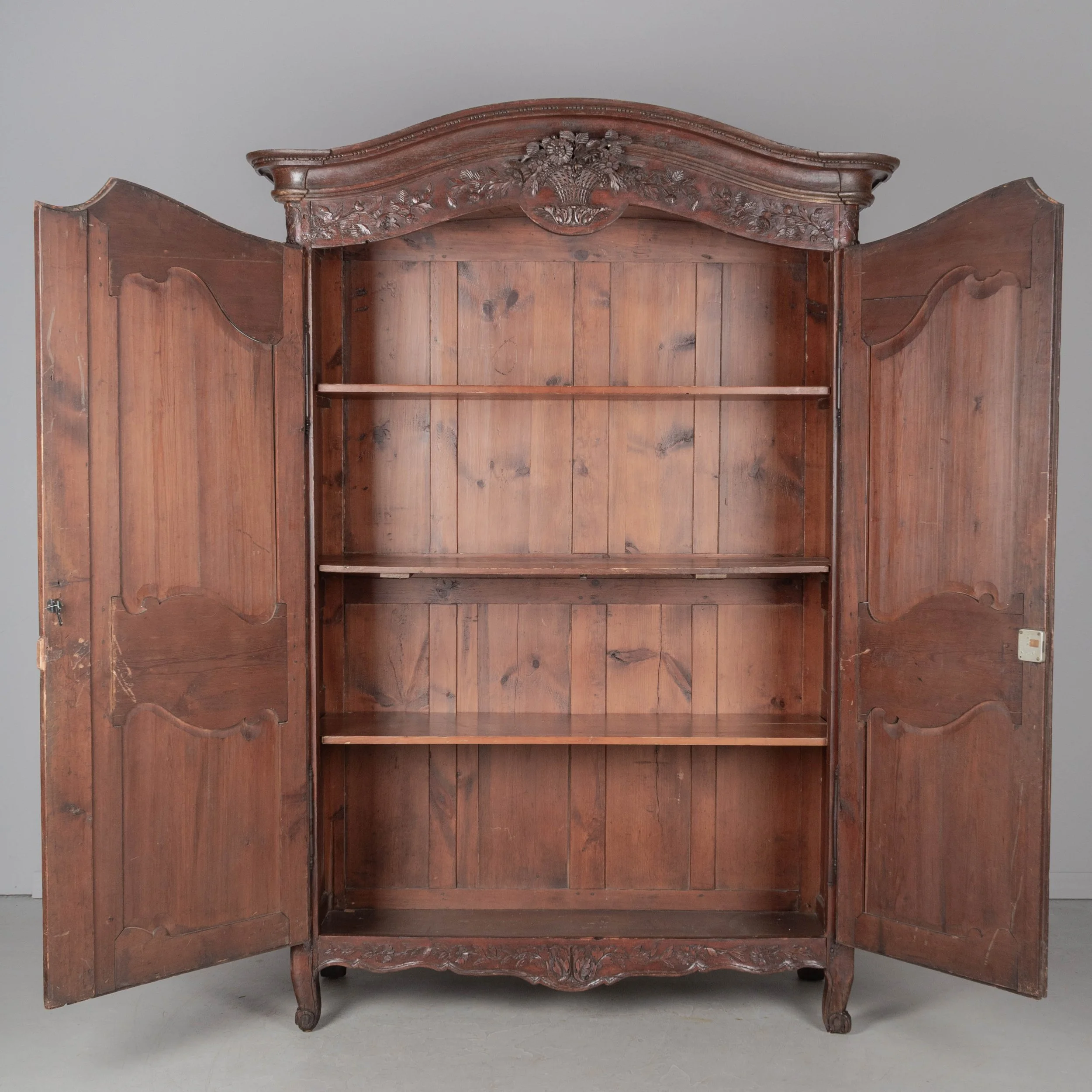 An early 19th century Louis XV country French bridal armoire from Normandy.