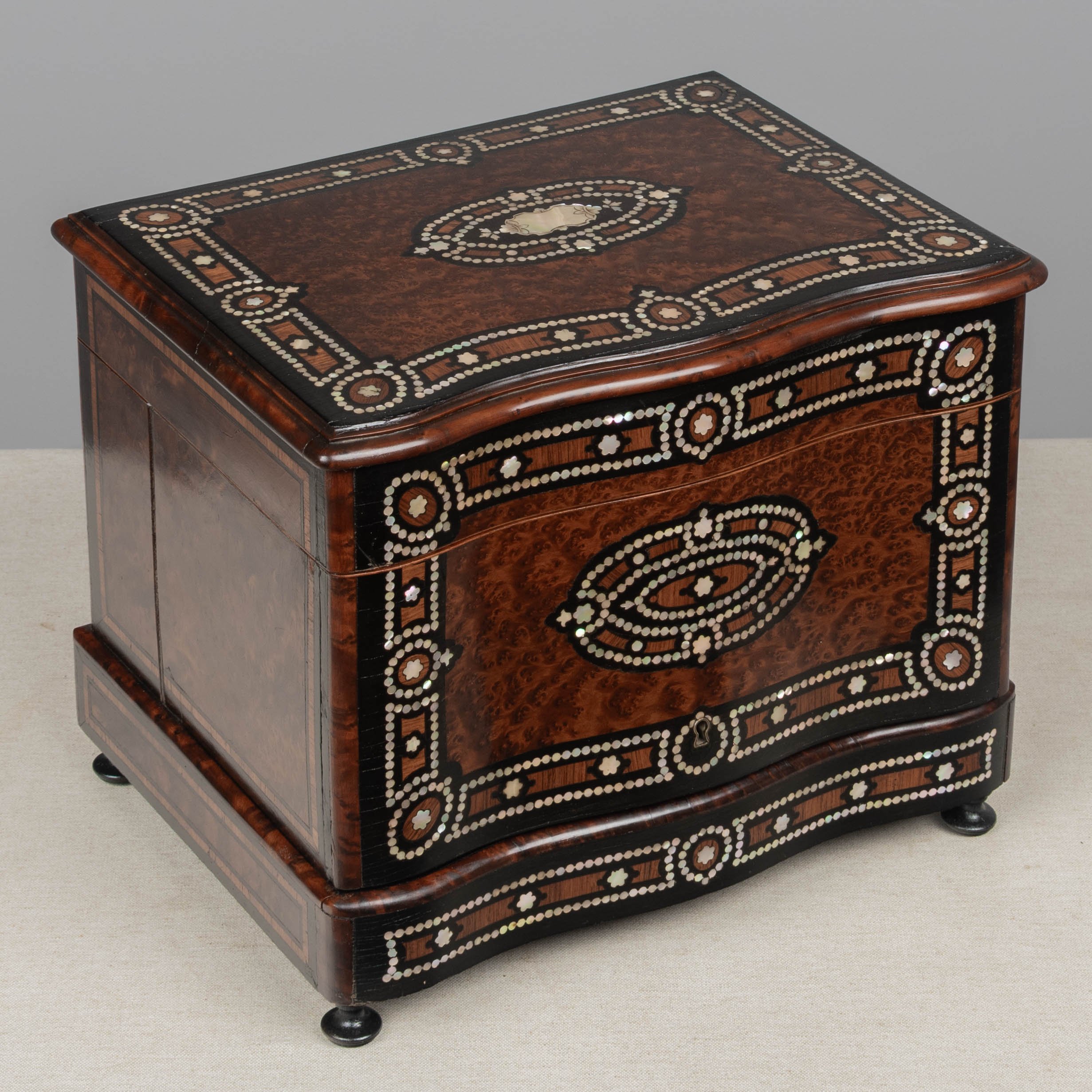 A fine 19th century French Napoleon III tantalus, or cave à liqueur, in the style of Charles-Guillaume Diehl