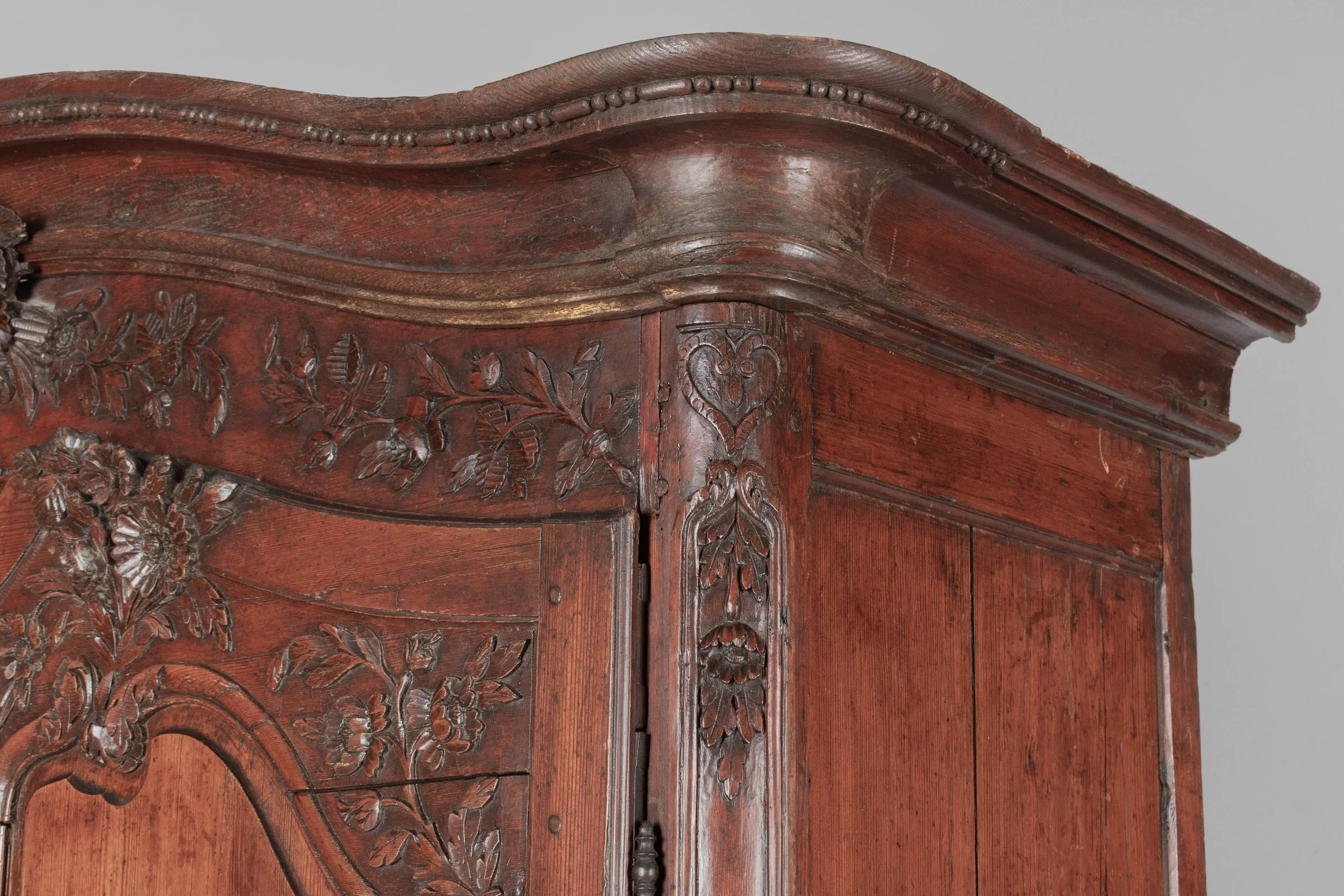 An early 19th century Louis XV country French bridal armoire from Normandy.