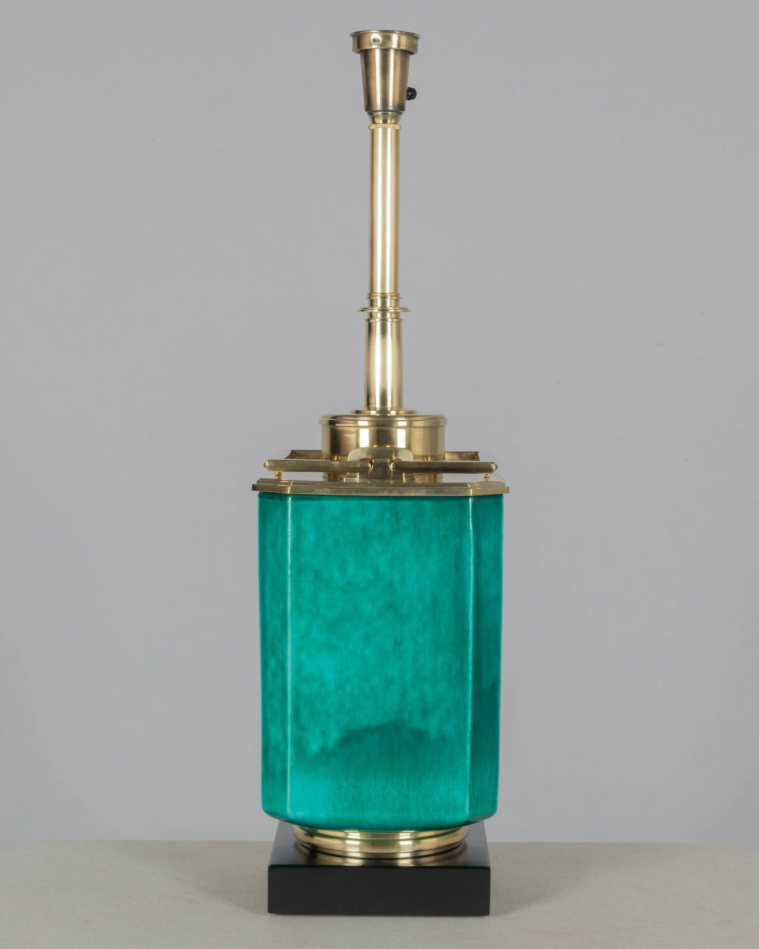 A Mid Century table lamp by Edwin Cole for Stiffel. Large octagonal deeply saturated heavy glazed ceramic body in beautiful shade of turquoise,