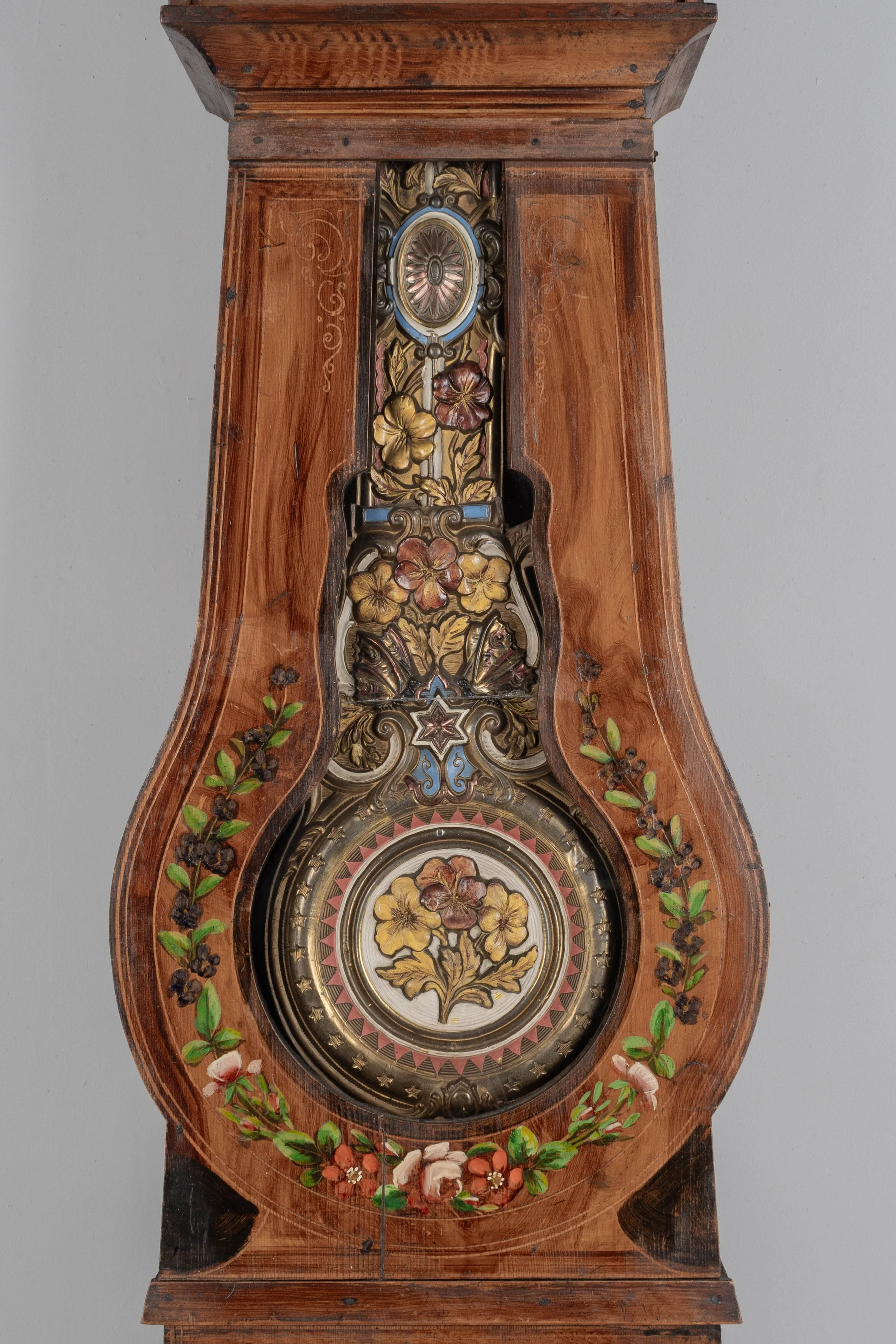 19th century Country French comtoise, or grandfather clock, with polychrome painted pine case and embossed brass pendulum.