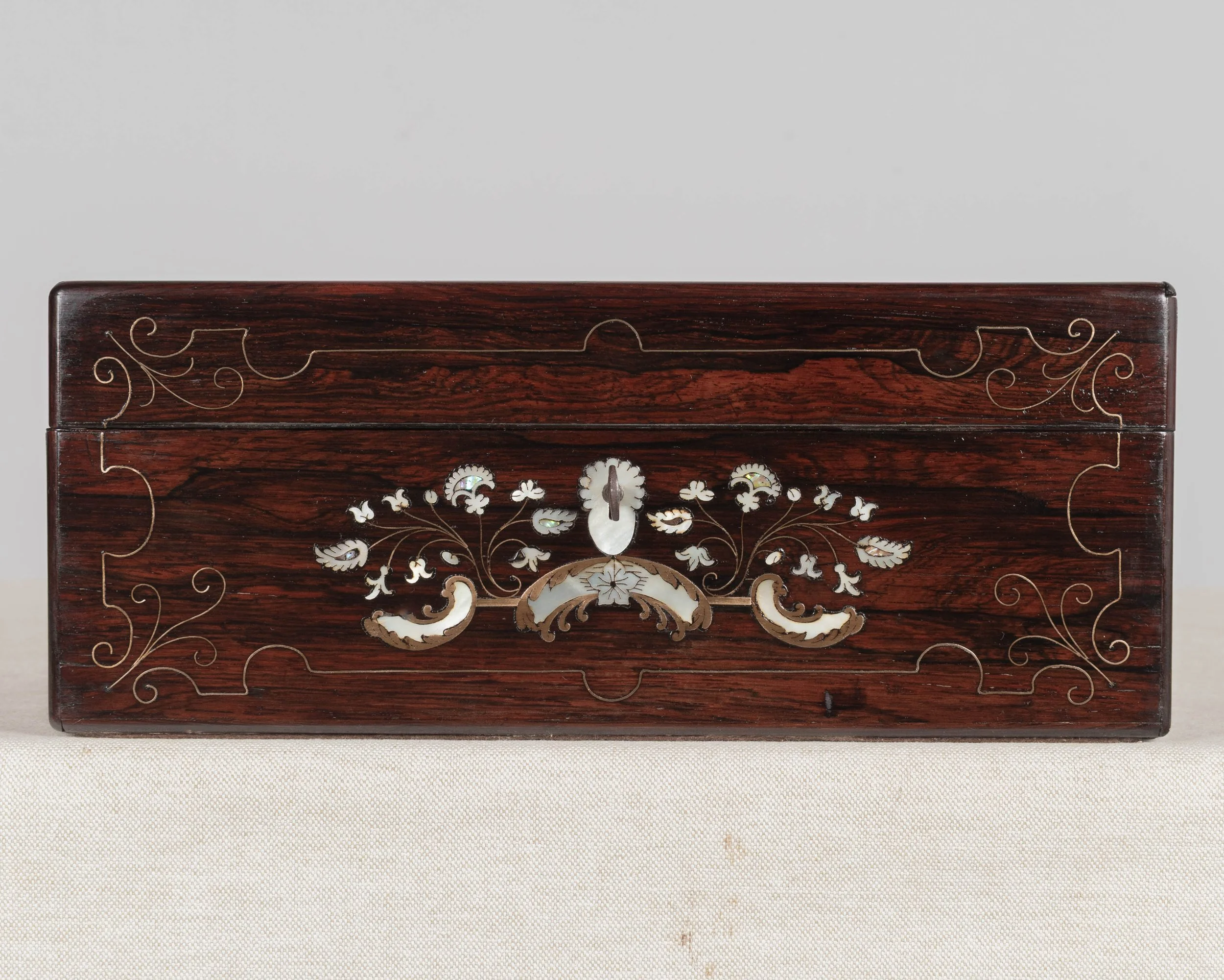 A 19th Century French Napoleon III marquetry box made of rosewood veneer with fine mother-of-pearl and brass inlay.