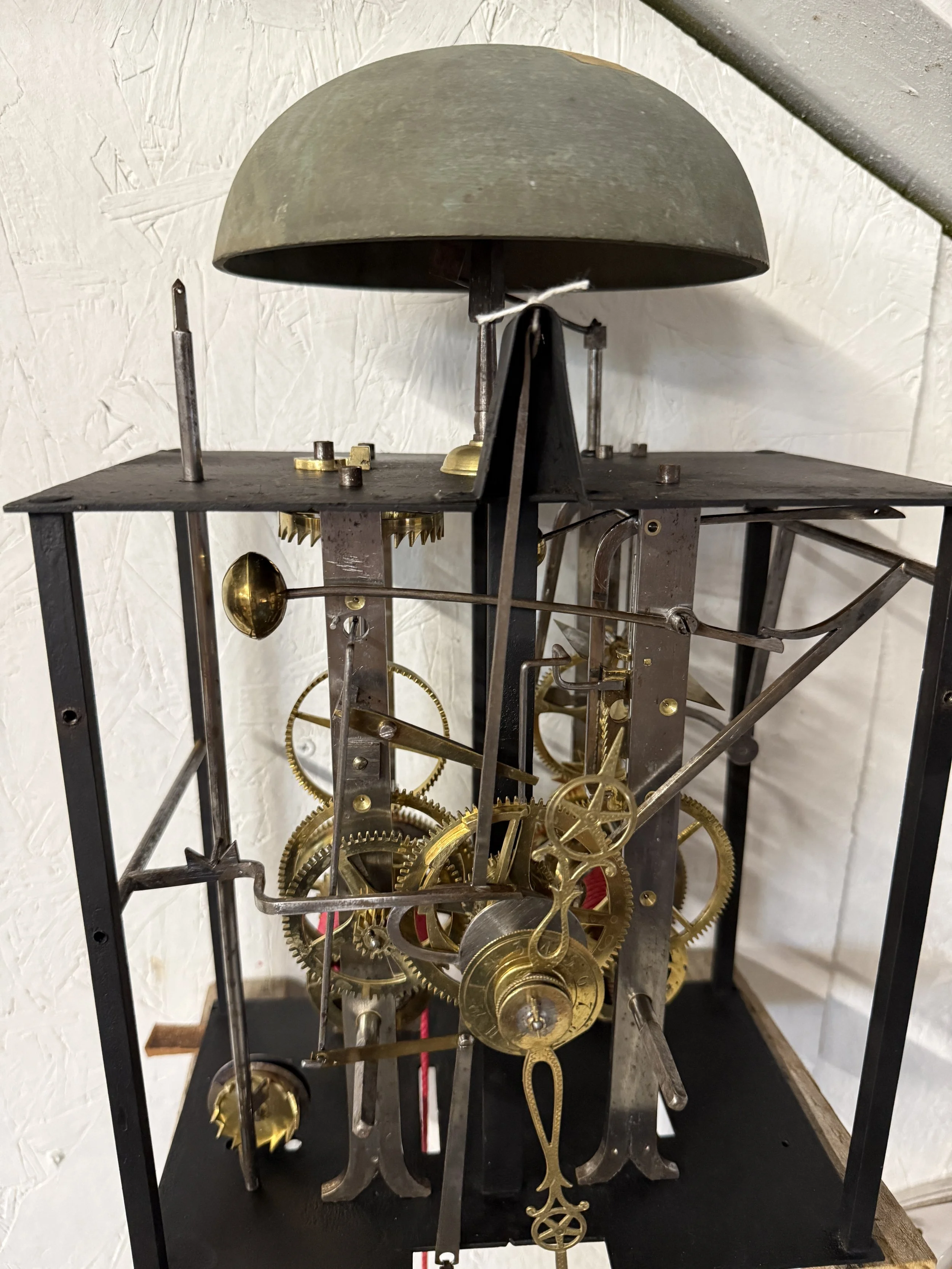 A late 19th century Morbier works for a tall case clock from Jobert Horloger at St Laurent Mâcon with brass embossment of Sun King