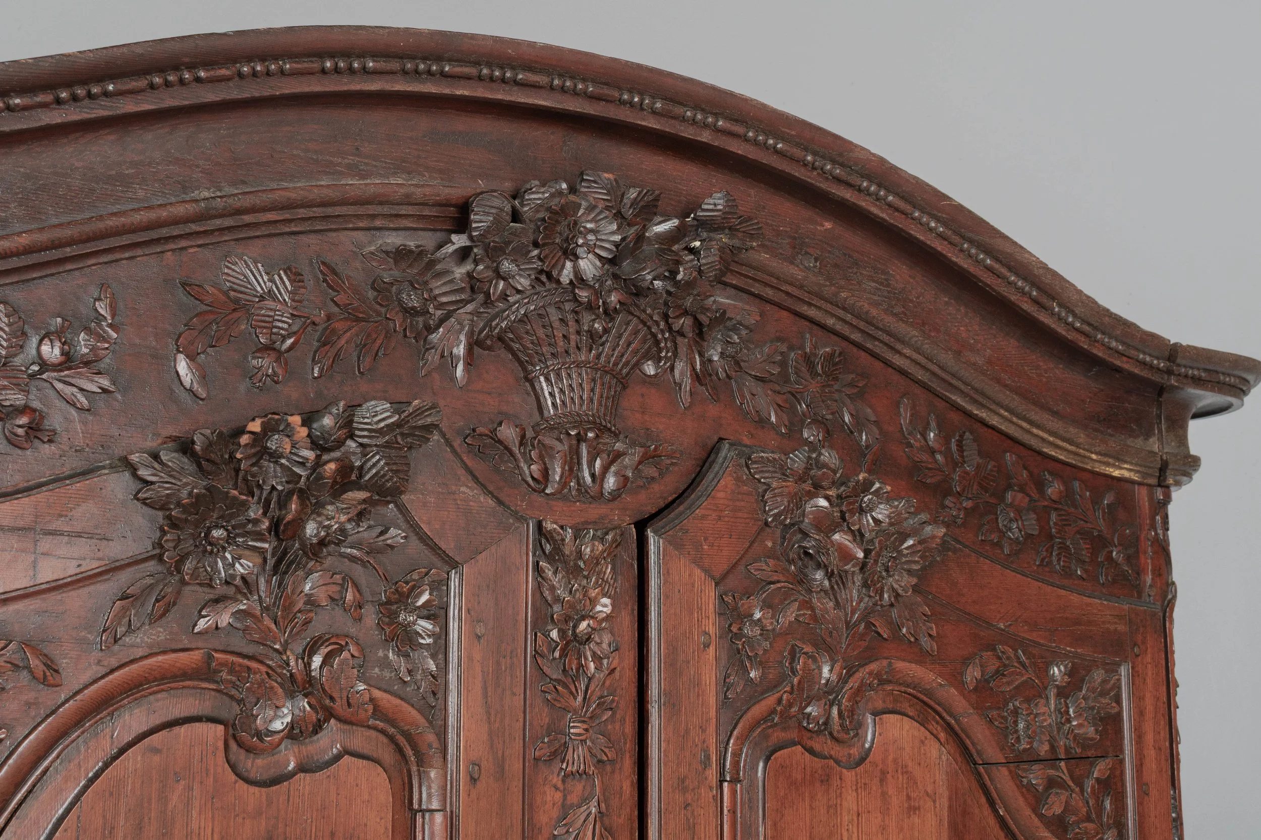 An early 19th century Louis XV country French bridal armoire from Normandy.
