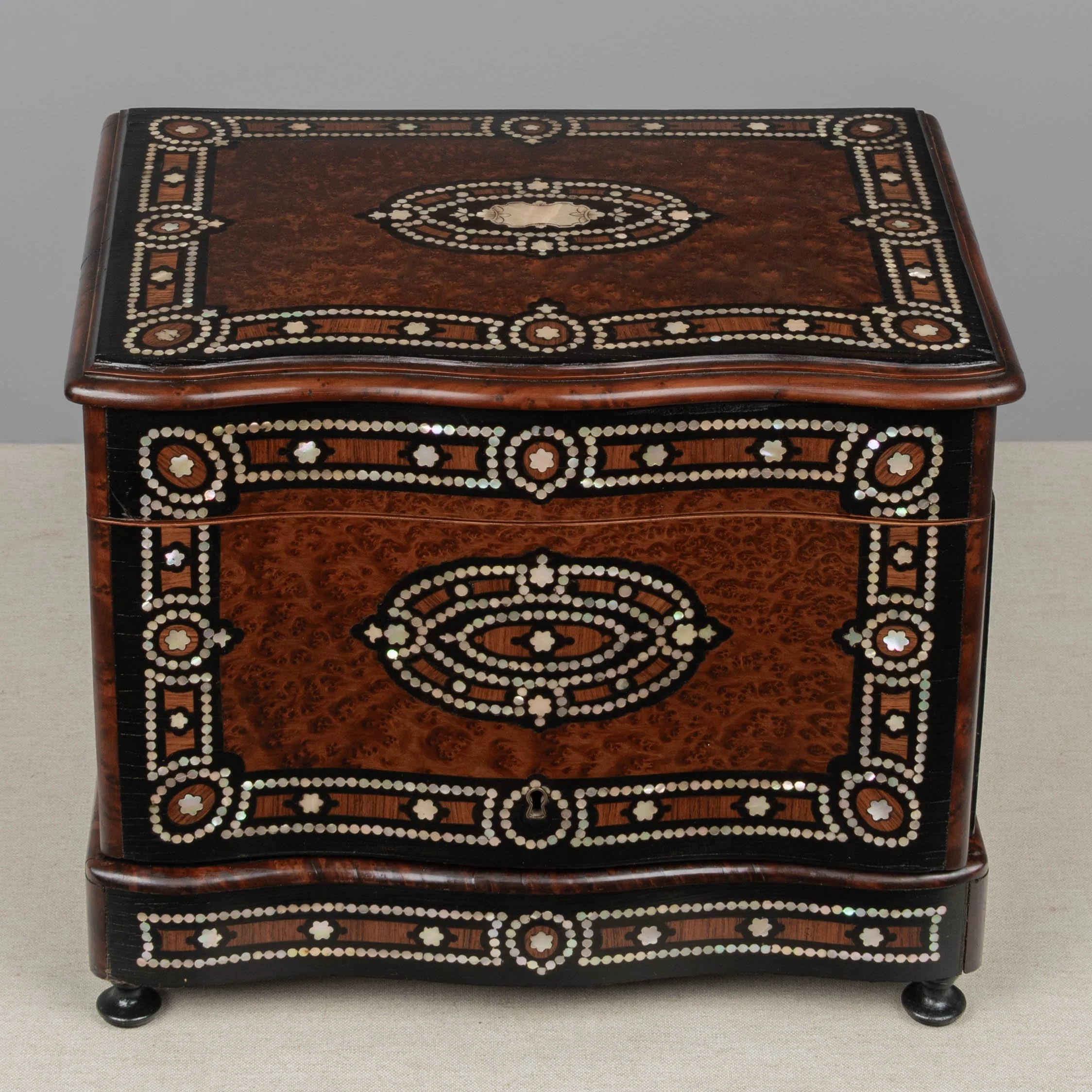 A fine 19th century French Napoleon III tantalus, or cave à liqueur, in the style of Charles-Guillaume Diehl