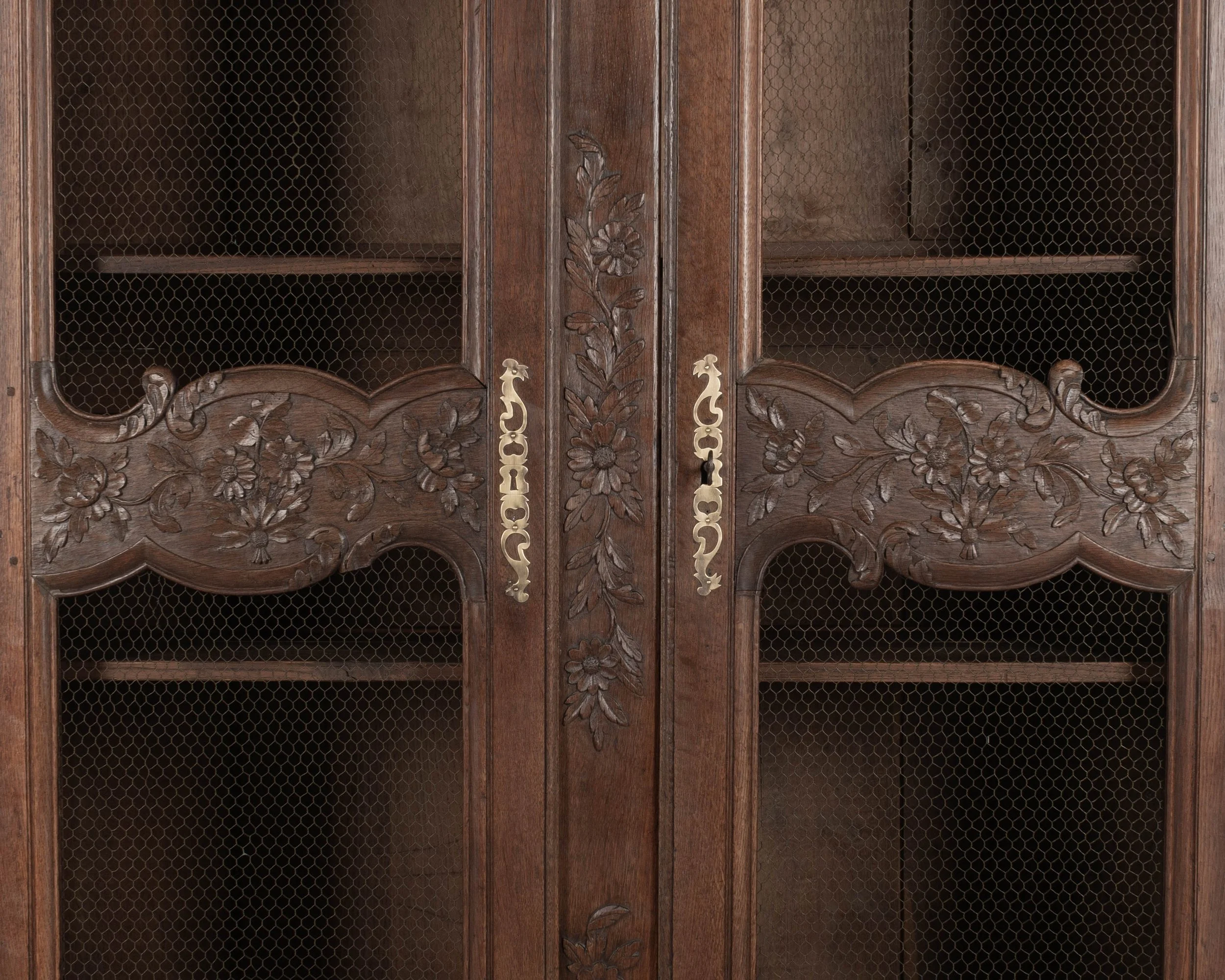 A 19th century Louis XV style Country French armoire, or display cabinet from Normandy.