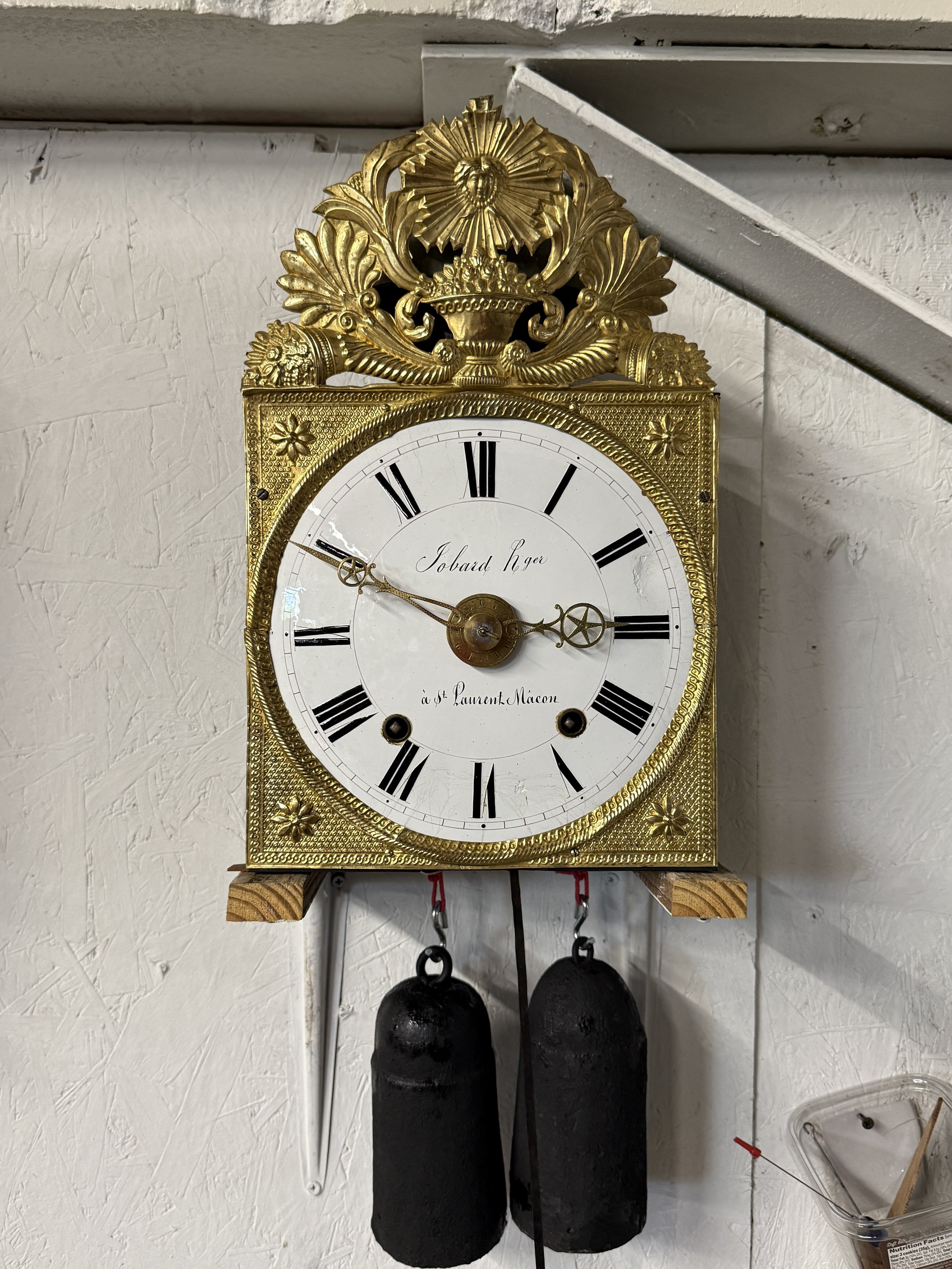 A late 19th century Morbier works for a tall case clock from Jobert Horloger at St Laurent Mâcon with brass embossment of Sun King