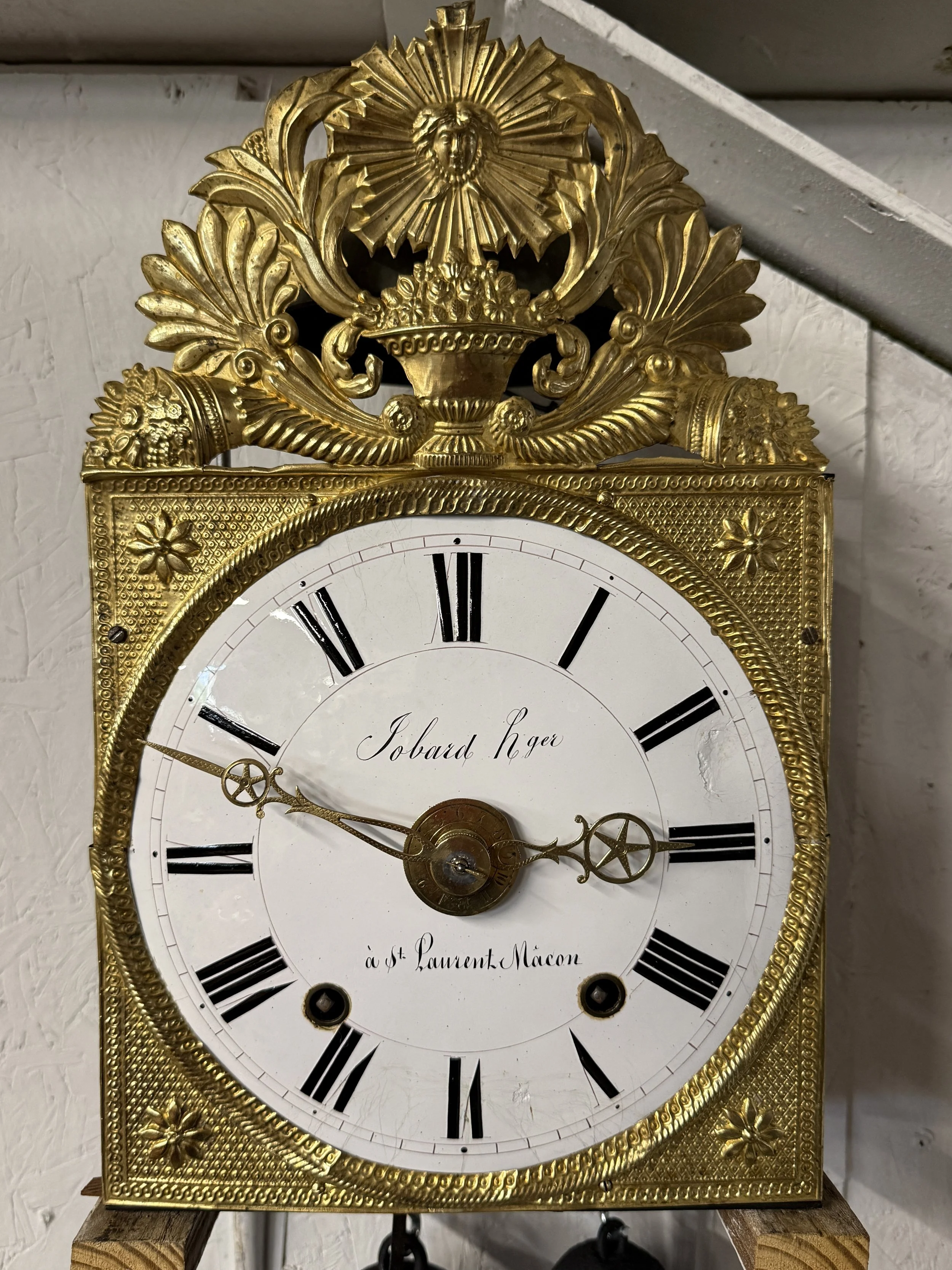 A late 19th century Morbier works for a tall case clock from Jobert Horloger at St Laurent Mâcon with brass embossment of Sun King