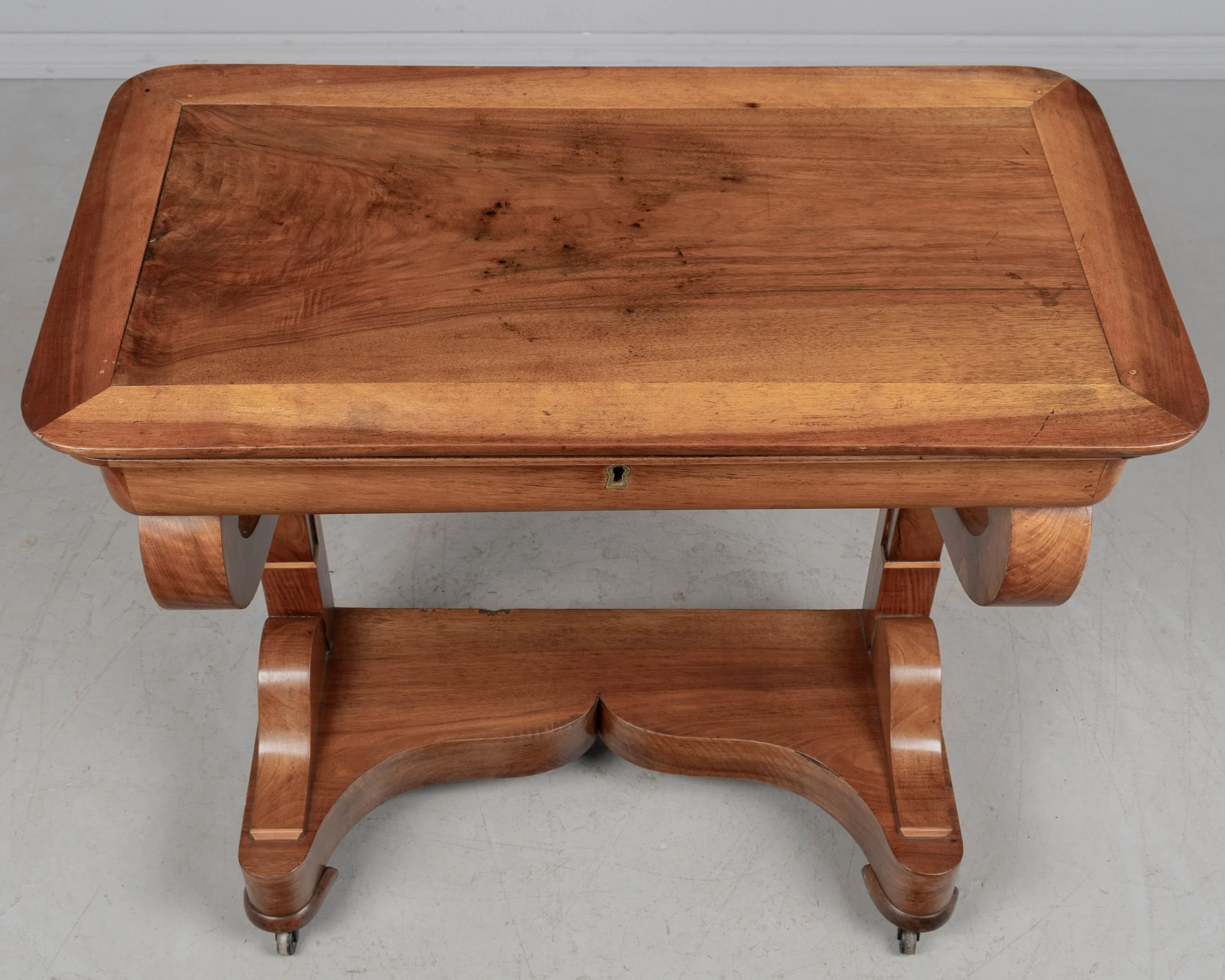 A 19th century French Louis-Philippe console made of solid walnut and veneer of walnut