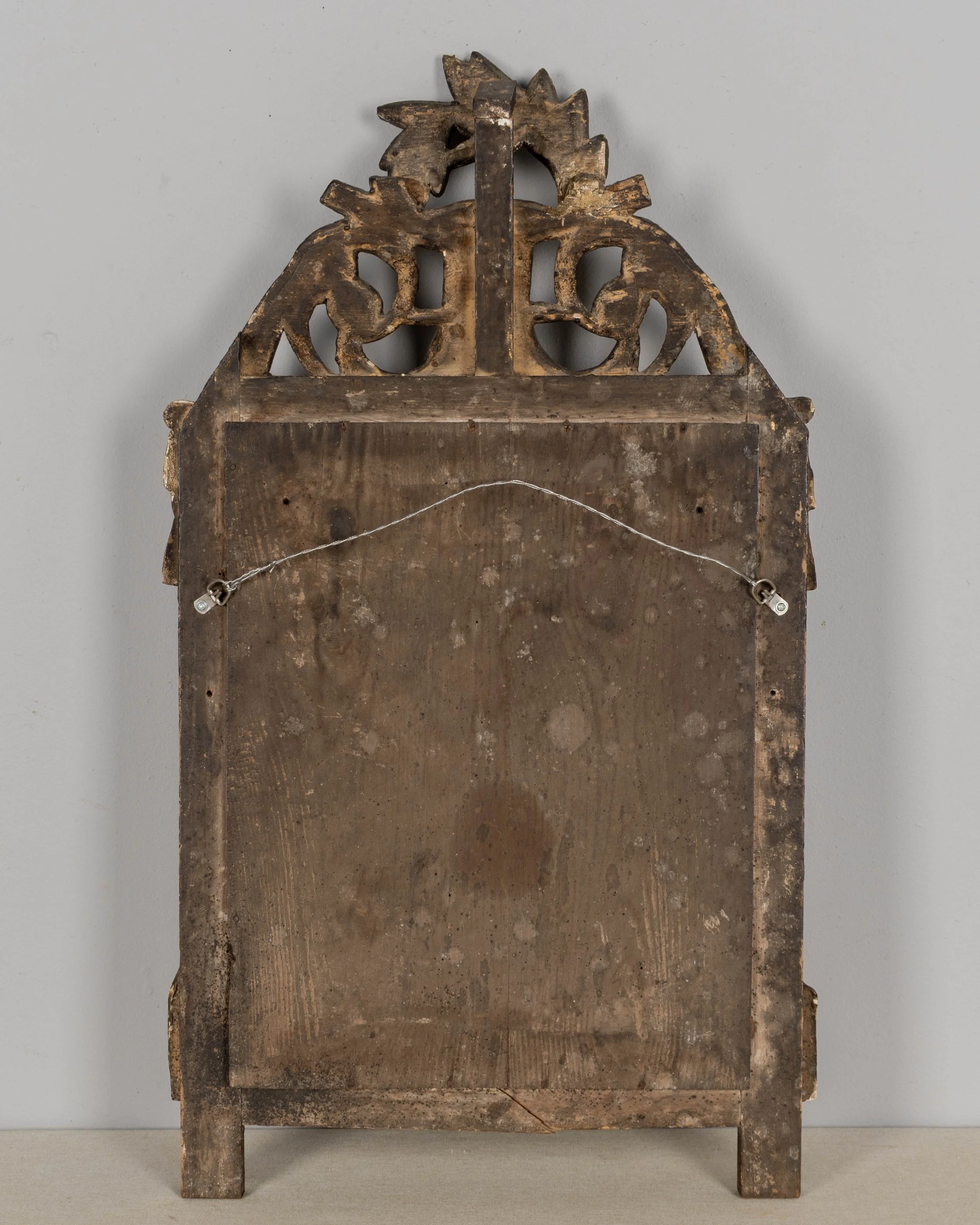 An early 19th century Louis XVI style French Provençal giltwood mirror.