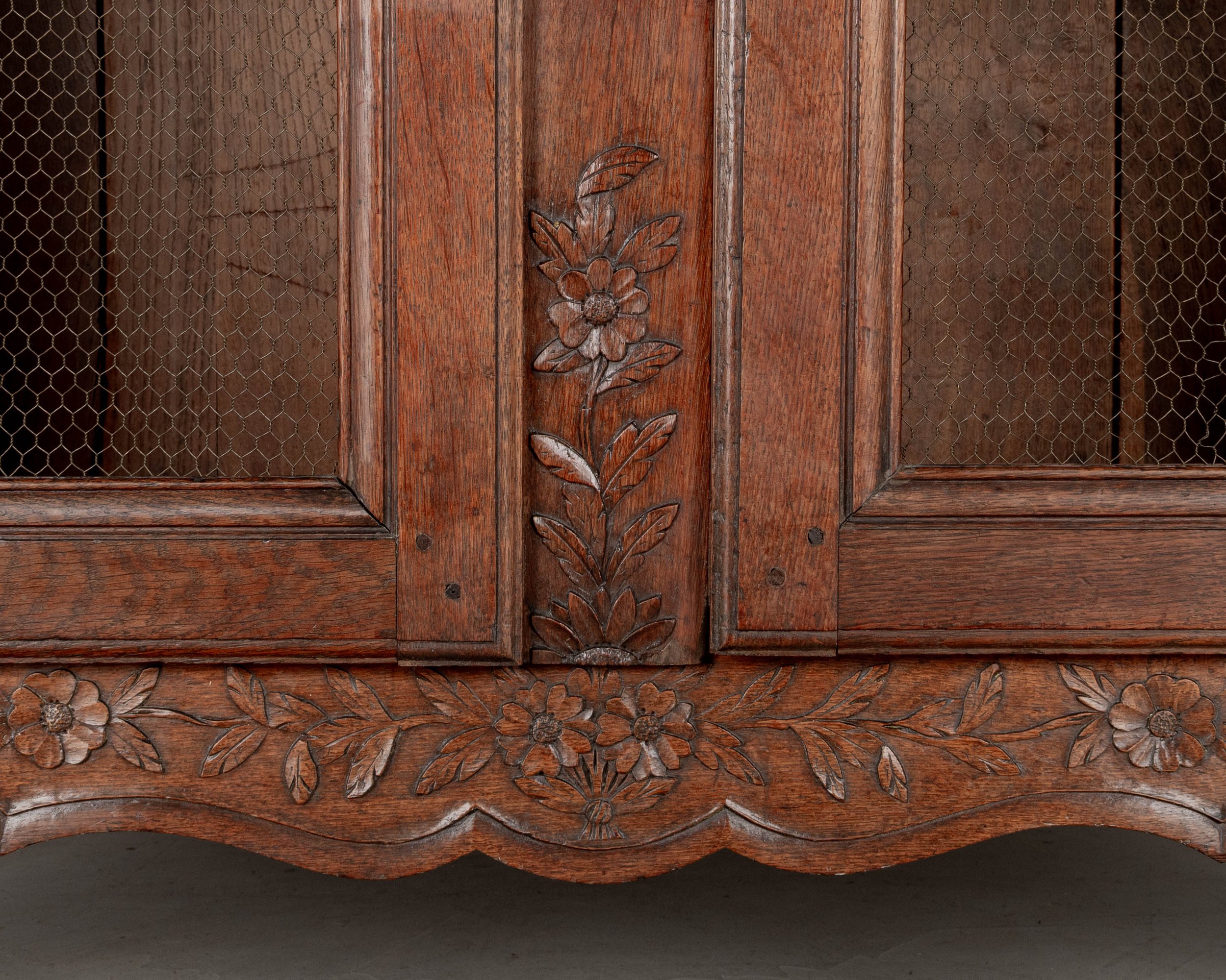 A 19th century Louis XV style Country French armoire, or display cabinet from Normandy.