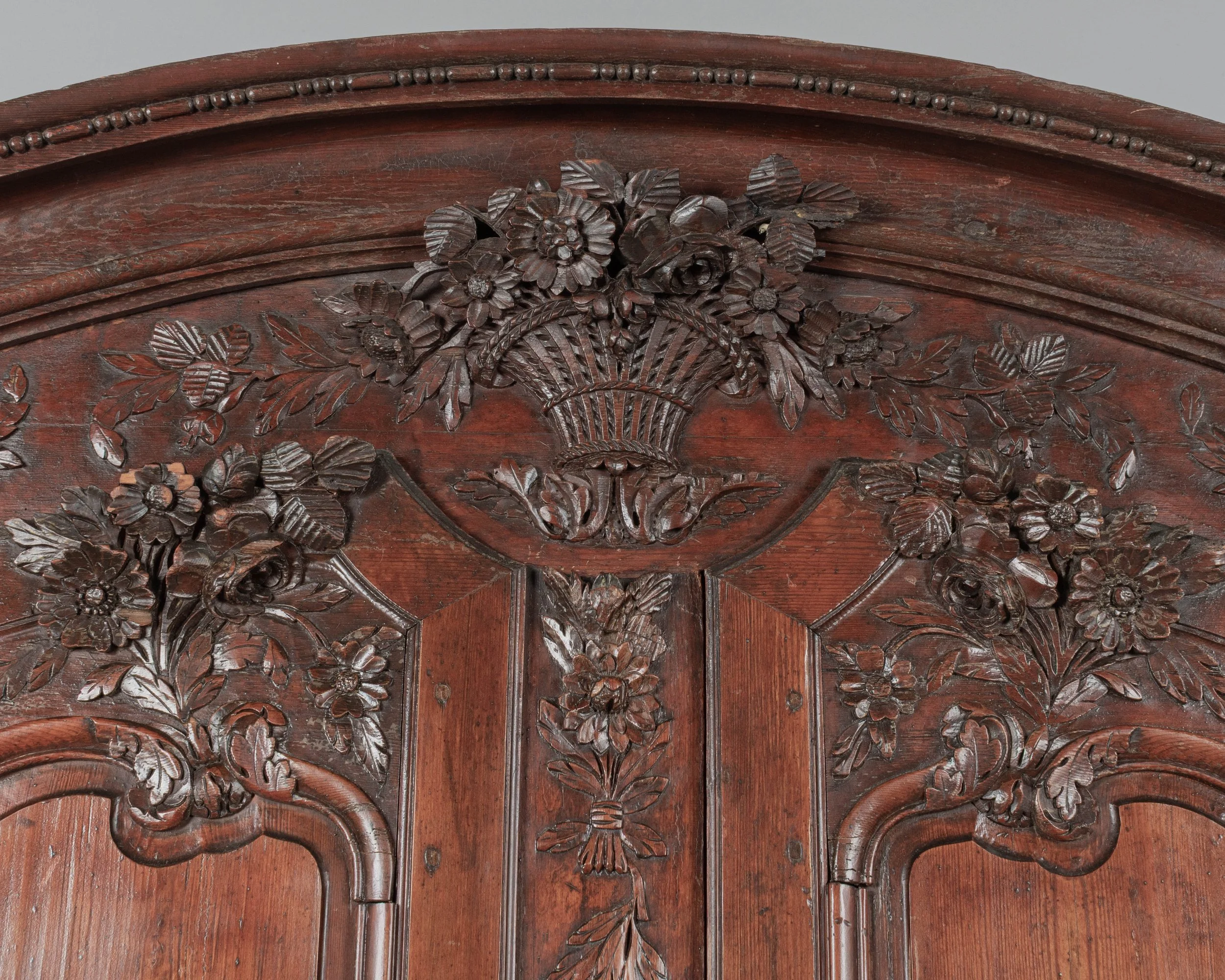 An early 19th century Louis XV country French bridal armoire from Normandy.