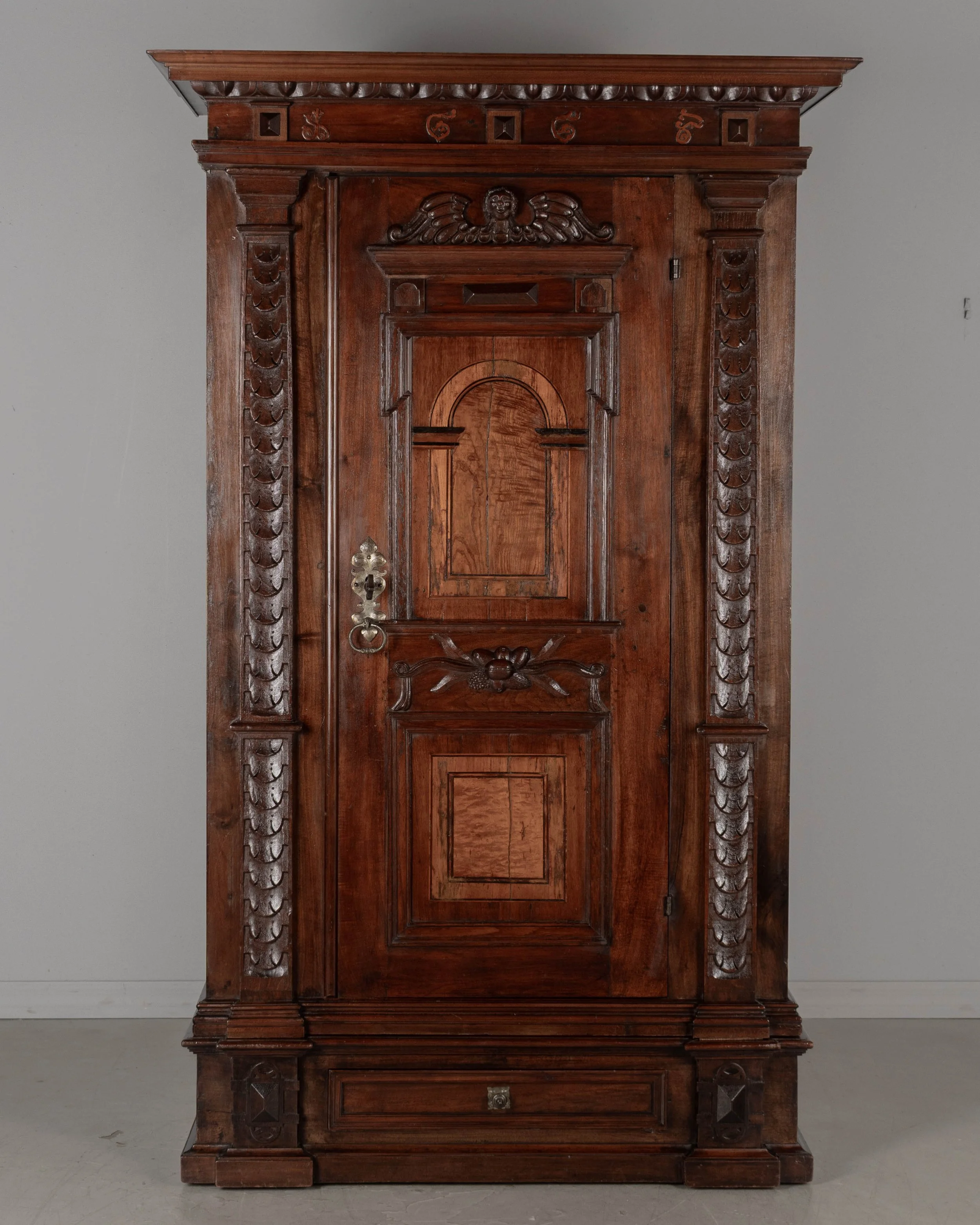 19th Century French Perigord Armoire made of solid walnut and veneers of walnut with pine as a secondary wood.