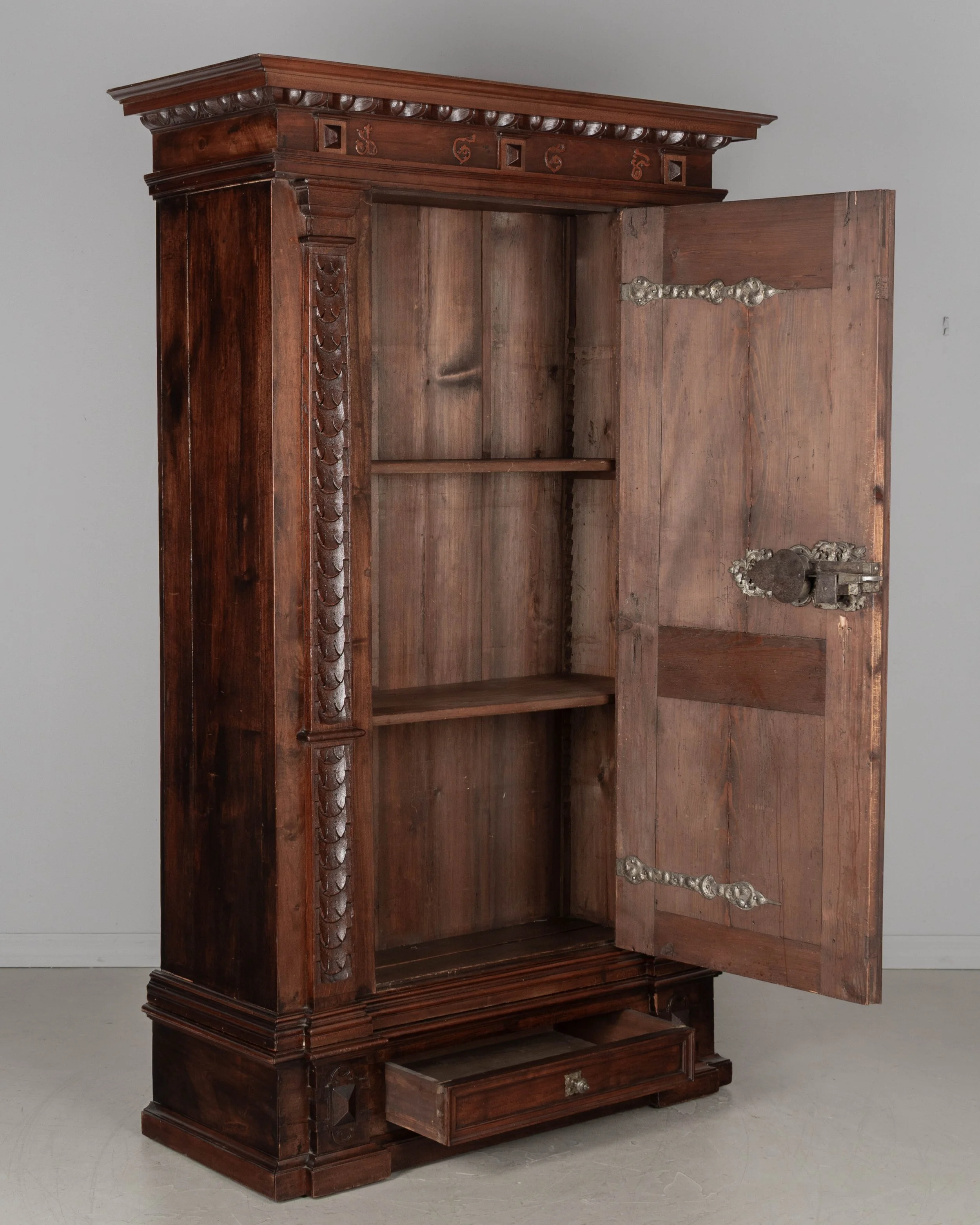 19th Century French Perigord Armoire made of solid walnut and veneers of walnut with pine as a secondary wood.