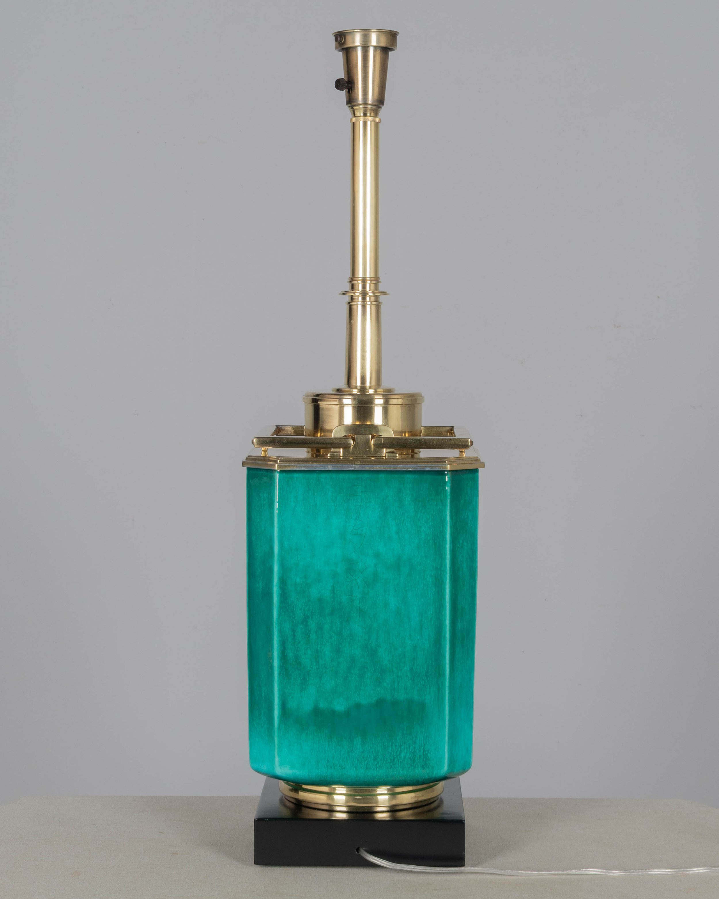 A Mid Century table lamp by Edwin Cole for Stiffel. Large octagonal deeply saturated heavy glazed ceramic body in beautiful shade of turquoise,