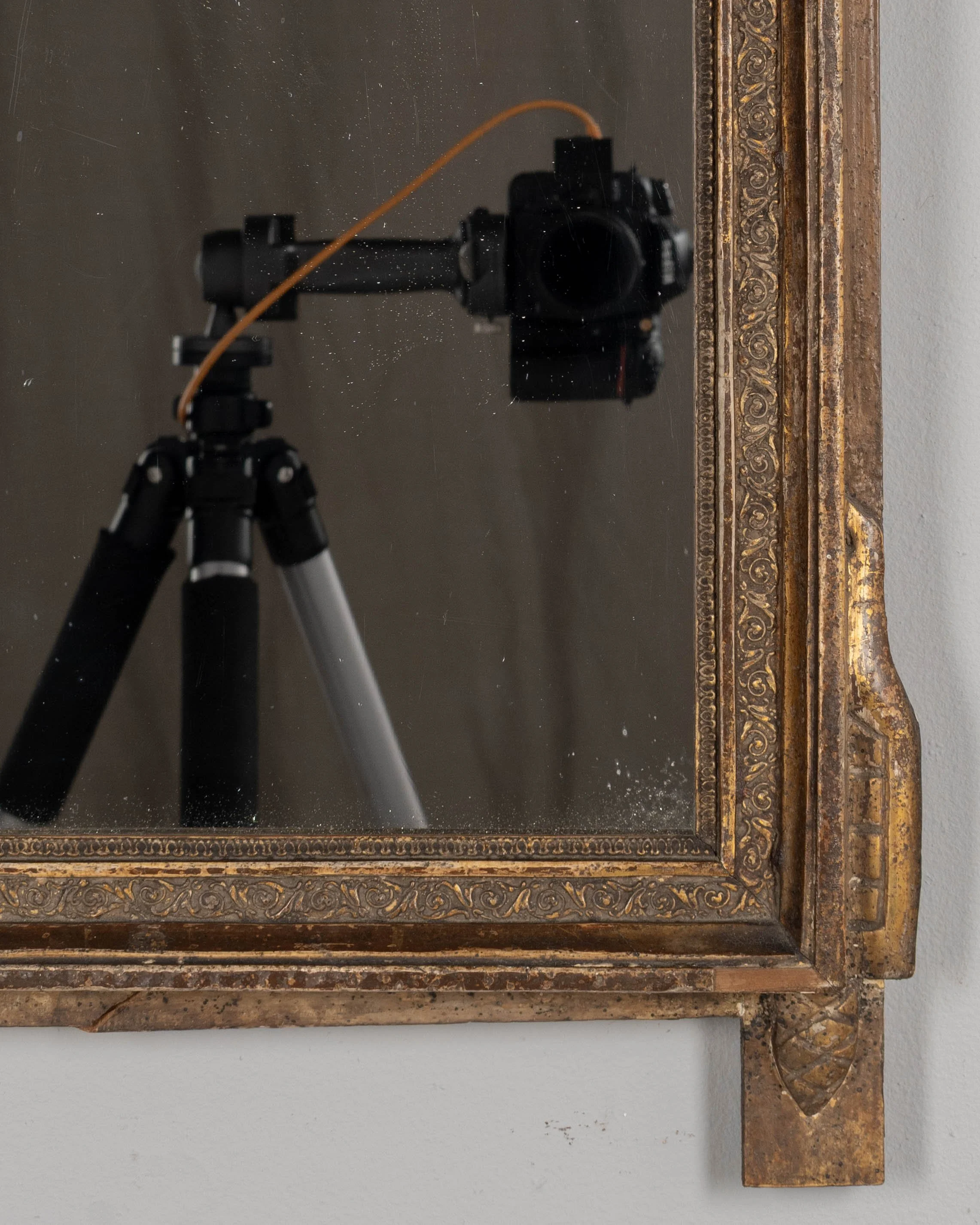 An early 19th century Louis XVI style French Provençal giltwood mirror.