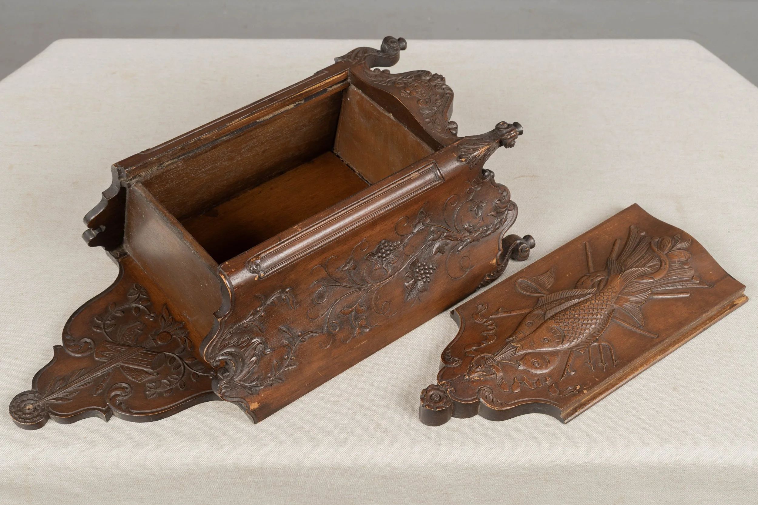 19th century French fariniere made of walnut with nicely detailed hand-carved decorative motifs: