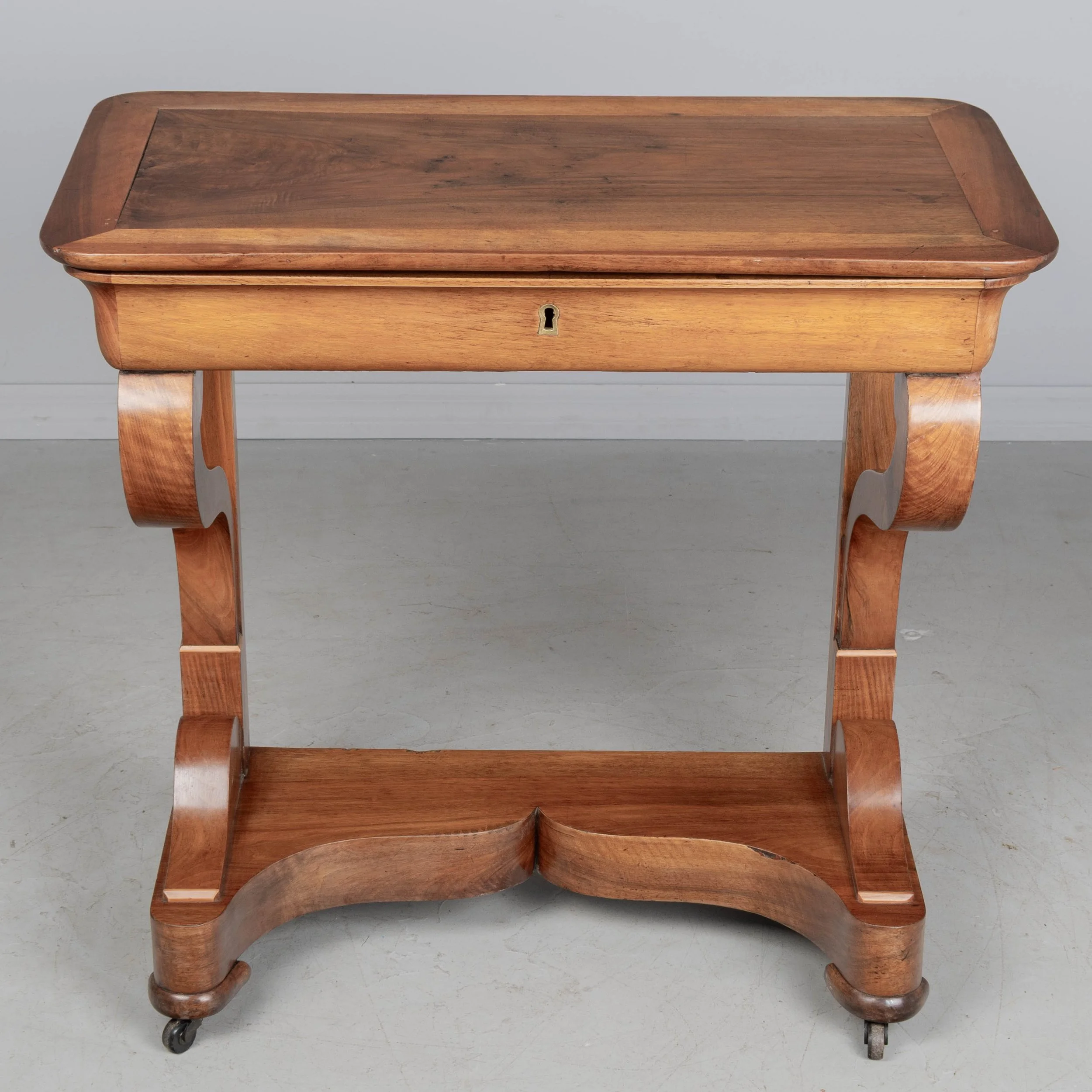 A 19th century French Louis-Philippe console made of solid walnut and veneer of walnut
