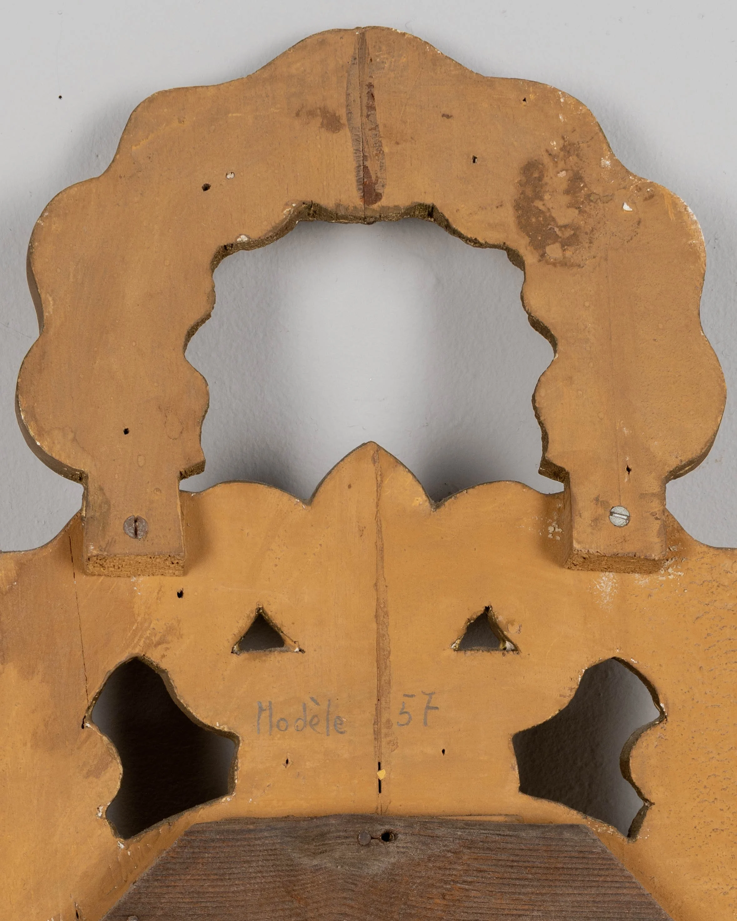 French Baroque style giltwood mirror with cartouche shape framed by undulating borders.