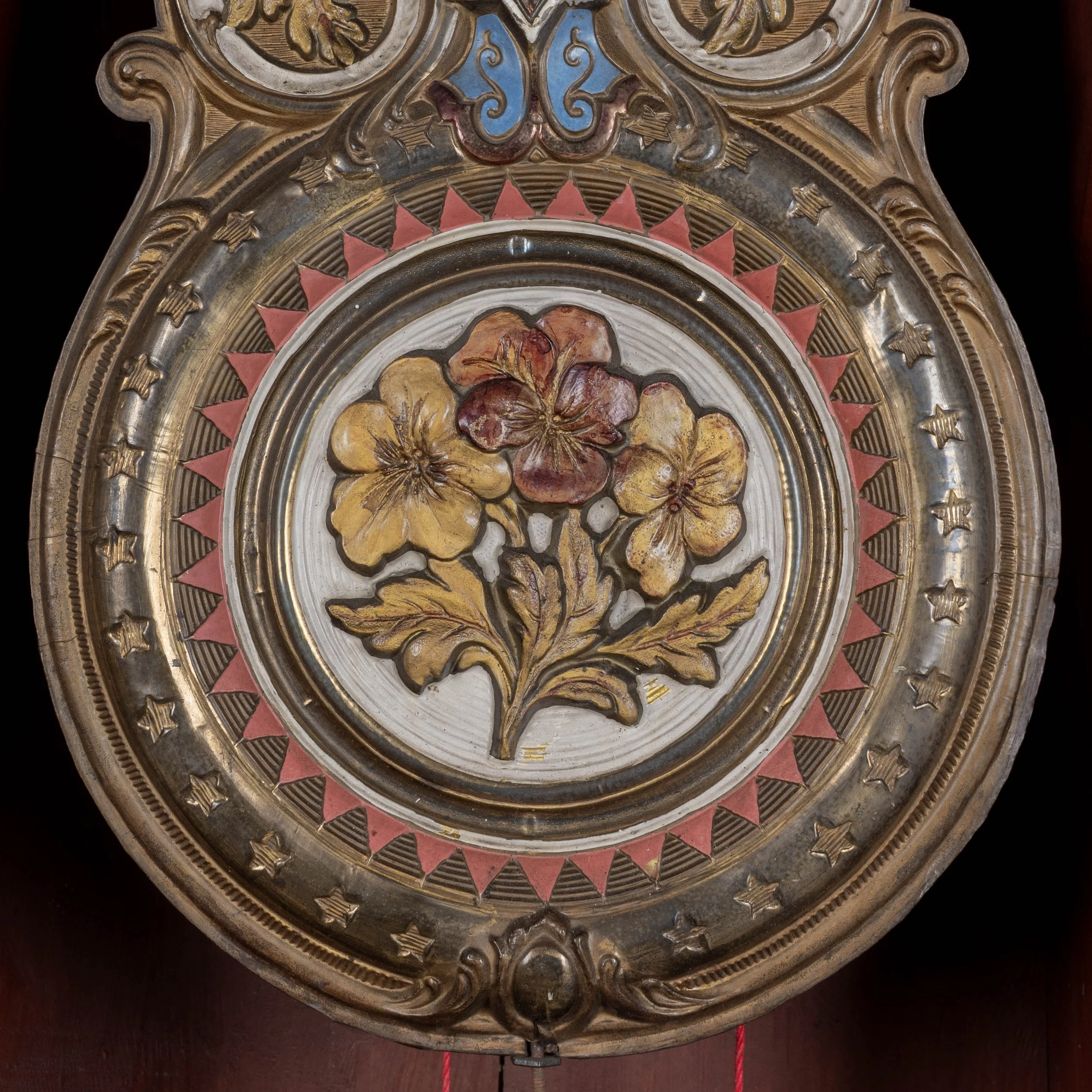 19th century Country French comtoise, or grandfather clock, with polychrome painted pine case and embossed brass pendulum.