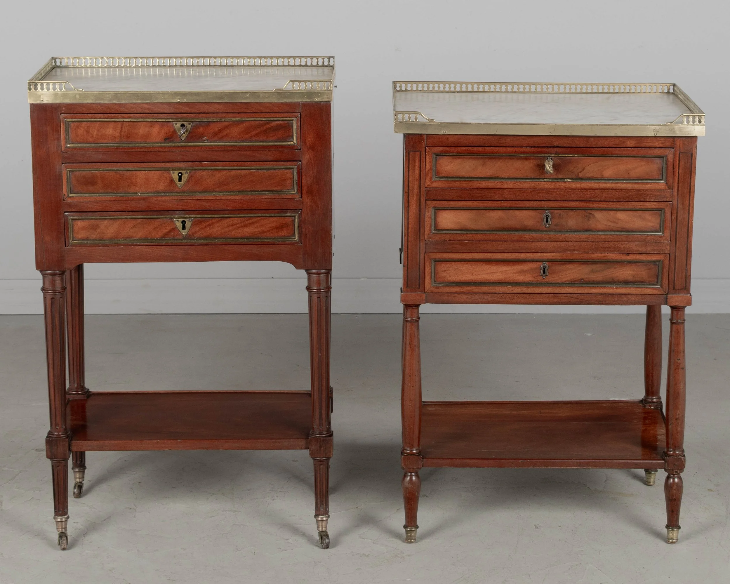 A 19th century French Louis XVI style marble top nightstand, or side table, made of veneers of mahogany with solid oak as a secondary wood