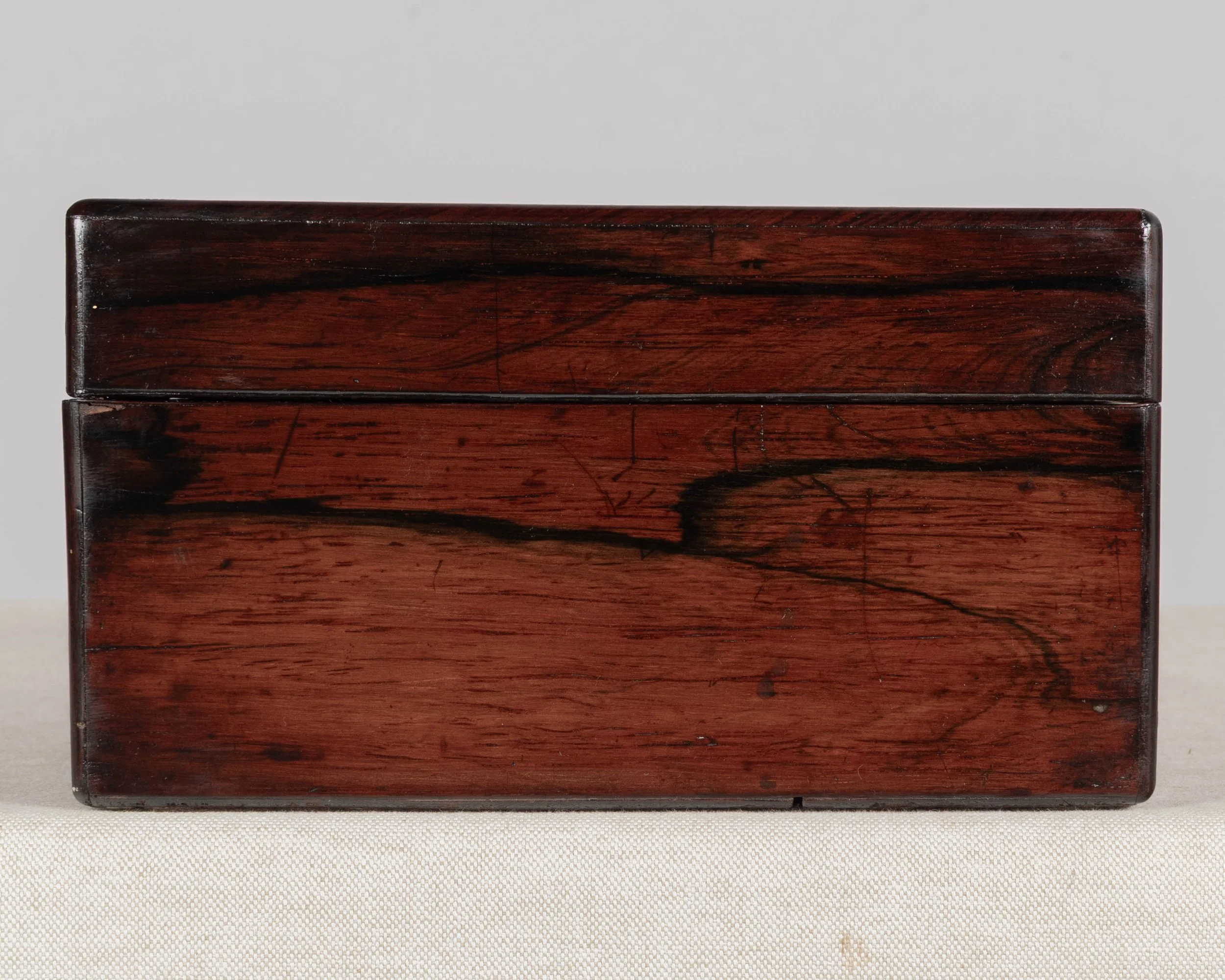 A 19th Century French Napoleon III marquetry box made of rosewood veneer with fine mother-of-pearl and brass inlay.