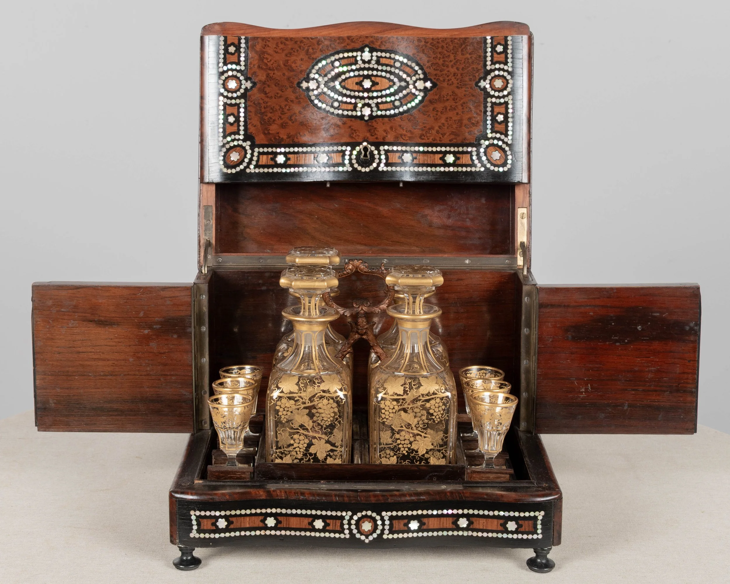 A fine 19th century French Napoleon III tantalus, or cave à liqueur, in the style of Charles-Guillaume Diehl