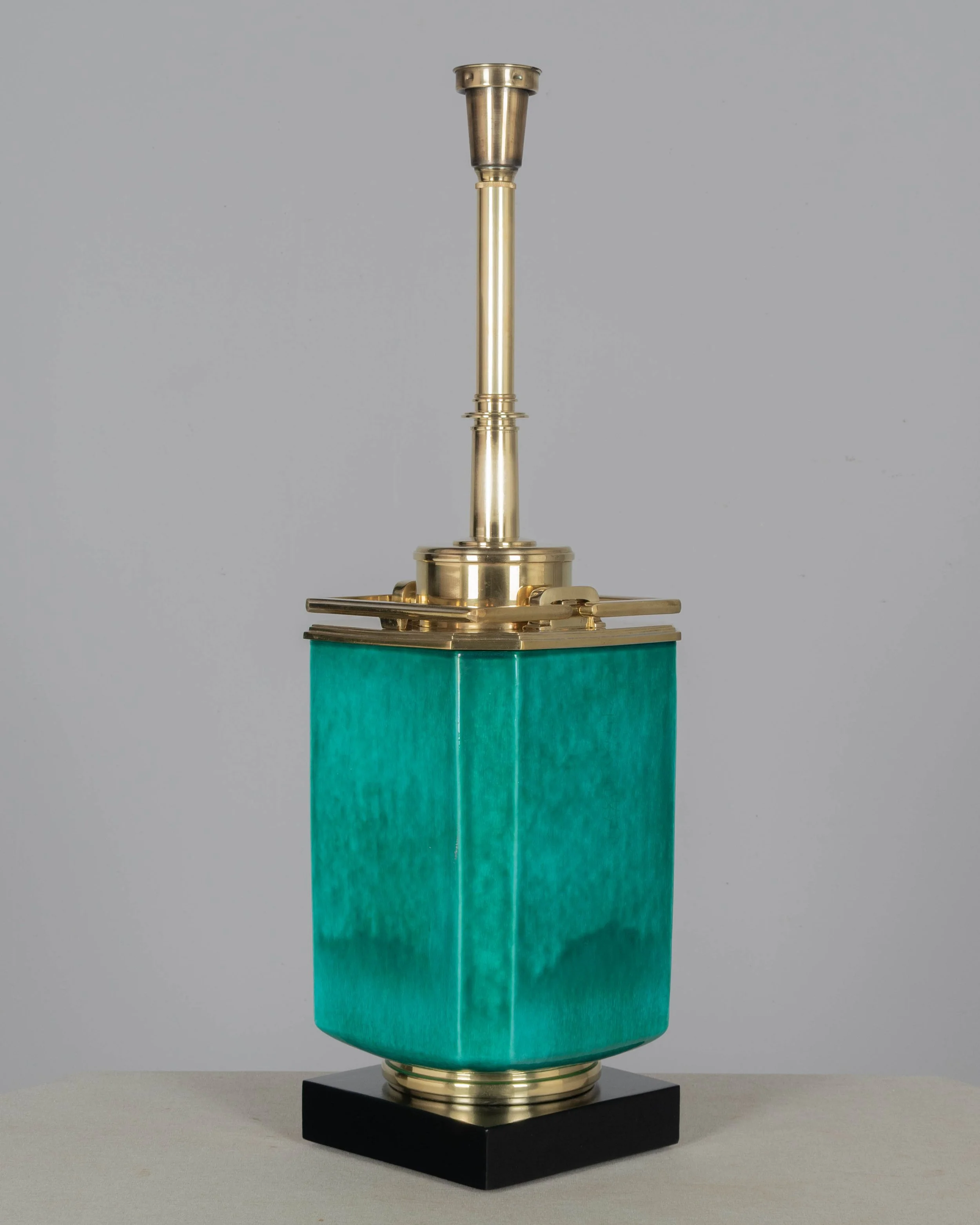 A Mid Century table lamp by Edwin Cole for Stiffel. Large octagonal deeply saturated heavy glazed ceramic body in beautiful shade of turquoise,