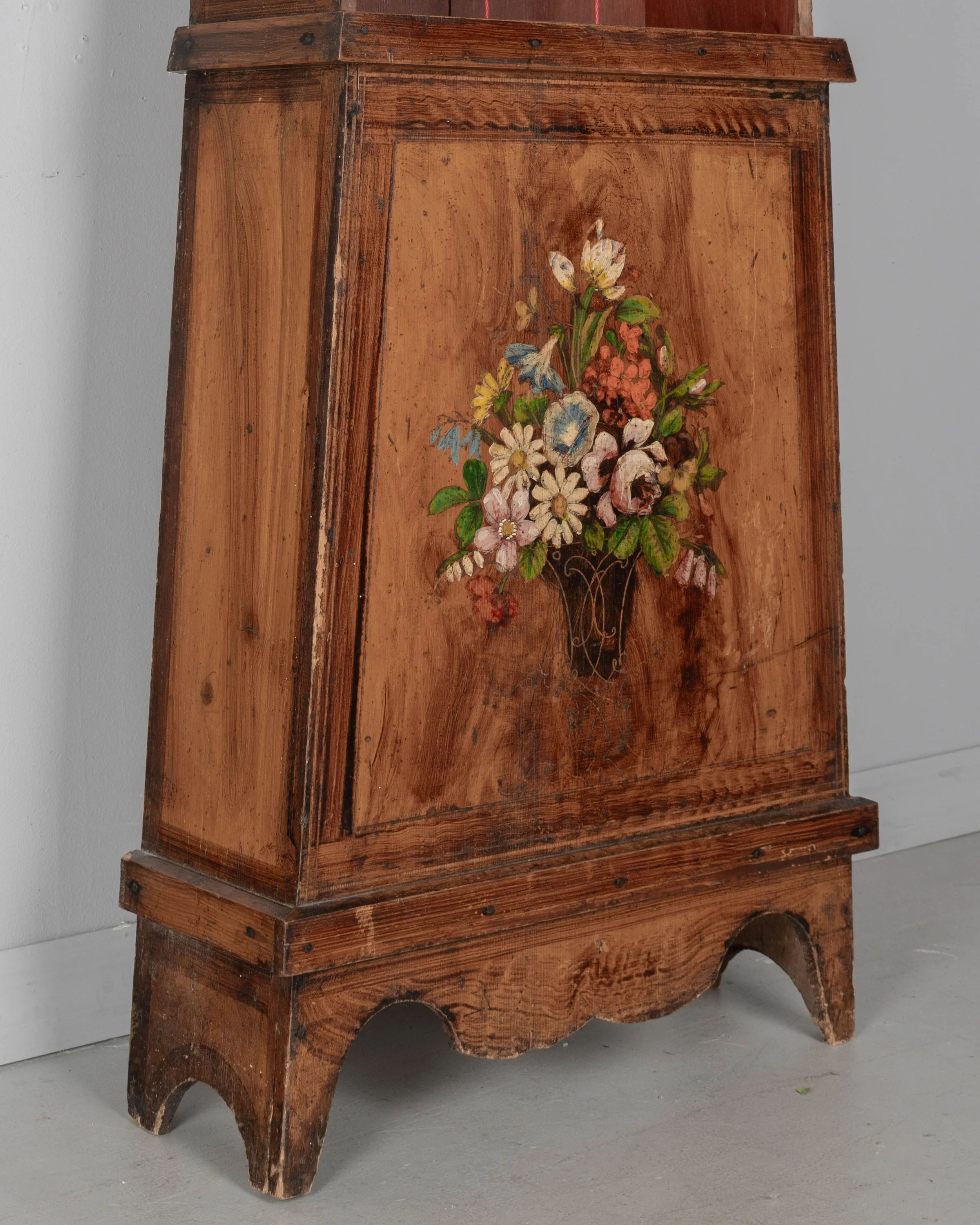 19th century Country French comtoise, or grandfather clock, with polychrome painted pine case and embossed brass pendulum.