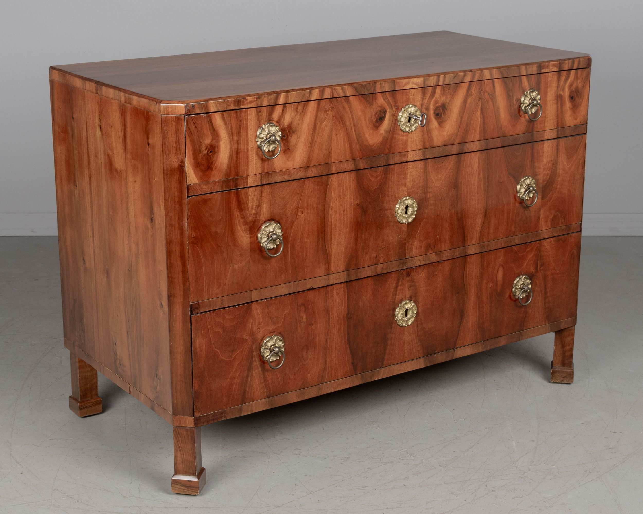 A fine 19th century Biedermeier commode from Austria made with beautifully patterned book matched veneer of walnut over pine.